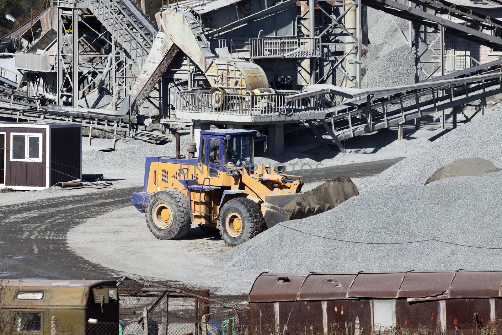 Heavy excavator at work in a stone quarry