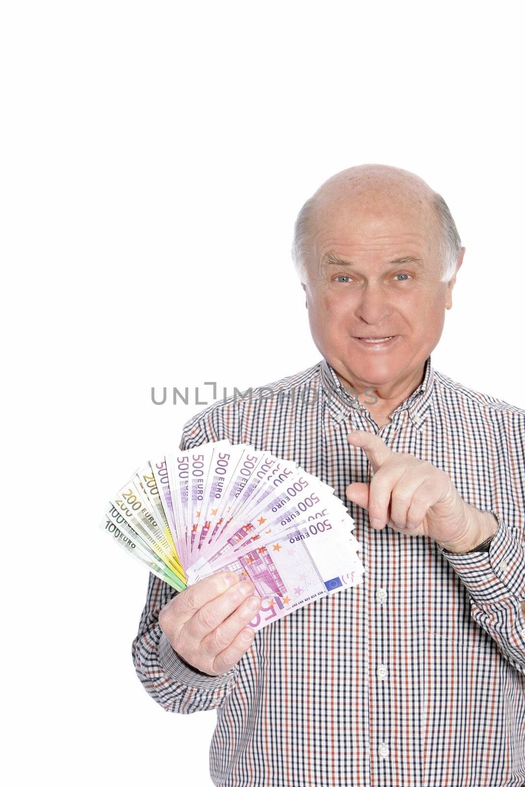 Successful senior man with a fistful of fanned out Euro banknotes in different denominations, isolated on white