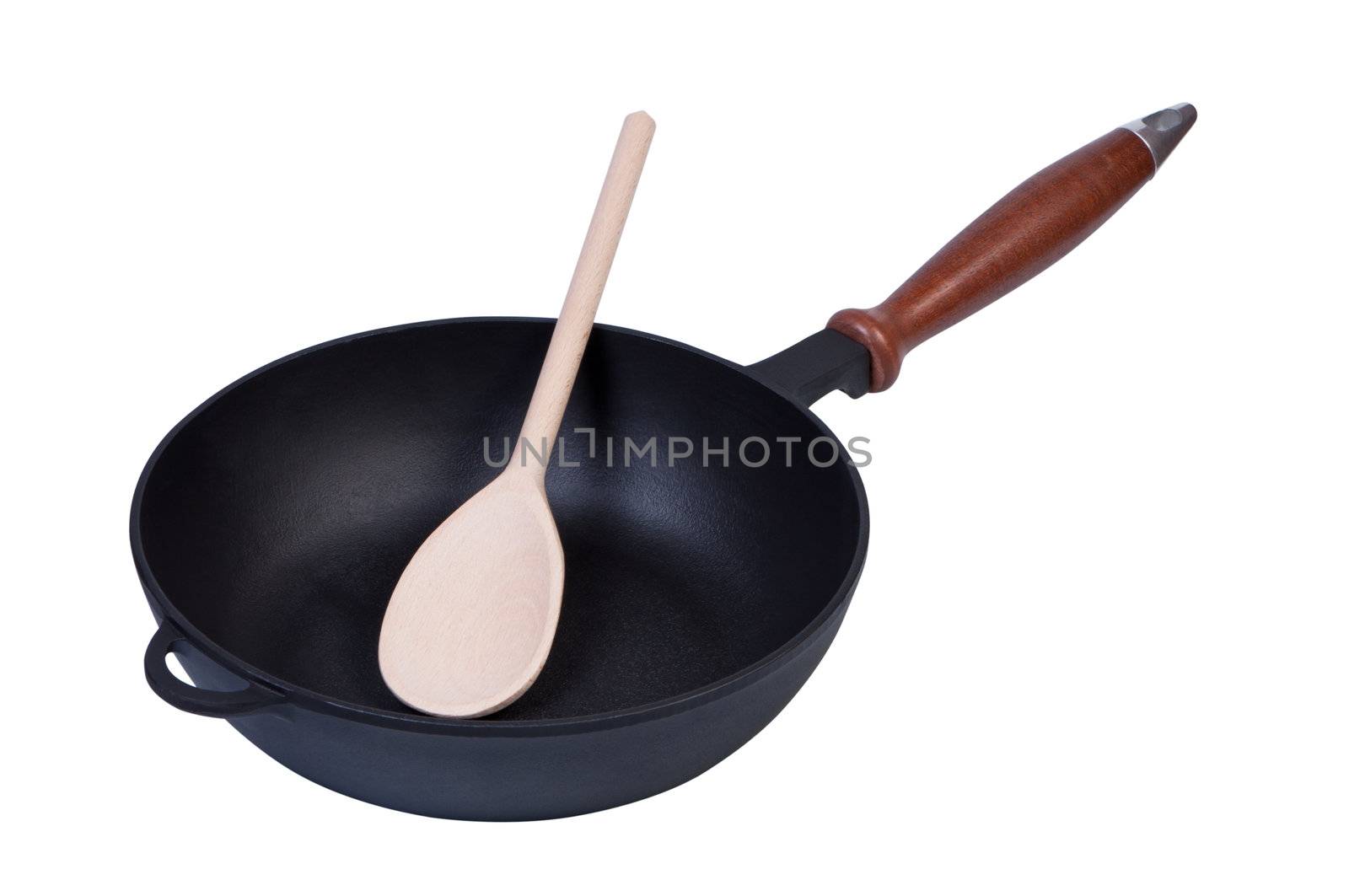 Frying pan on white background with wooden spoon inside.