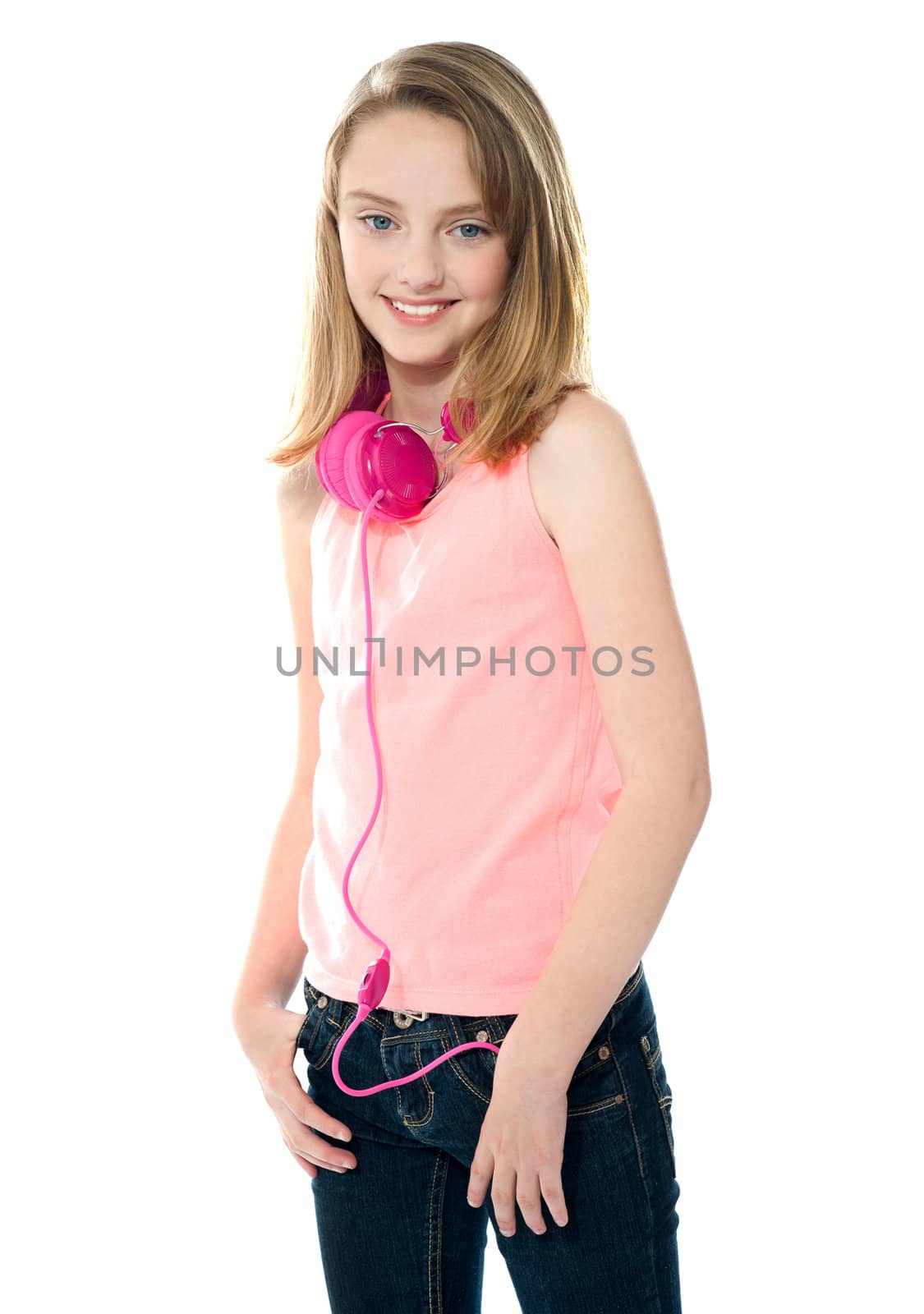 Stylish trendy girl with headphones around her neck