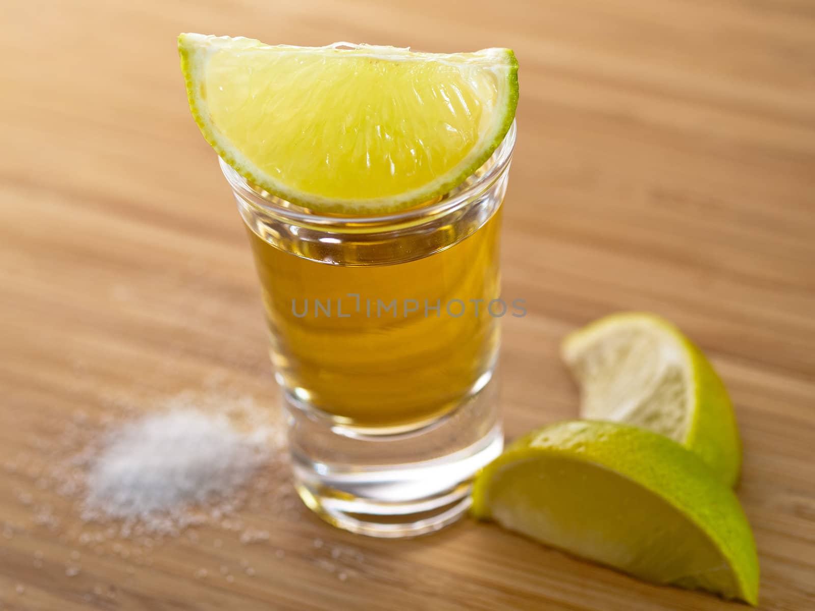 Shot of tequila with salt and lime
