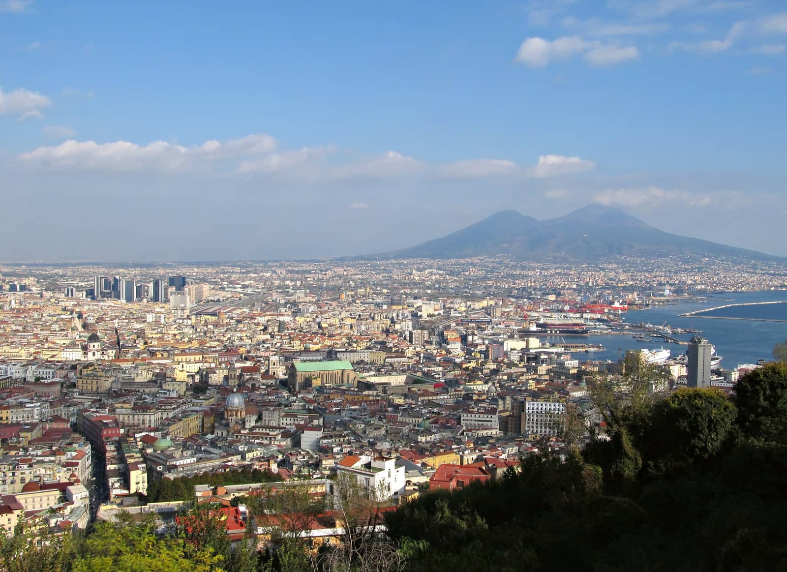 View of Naples in a sunny day with Mount Vesuvius at the background.