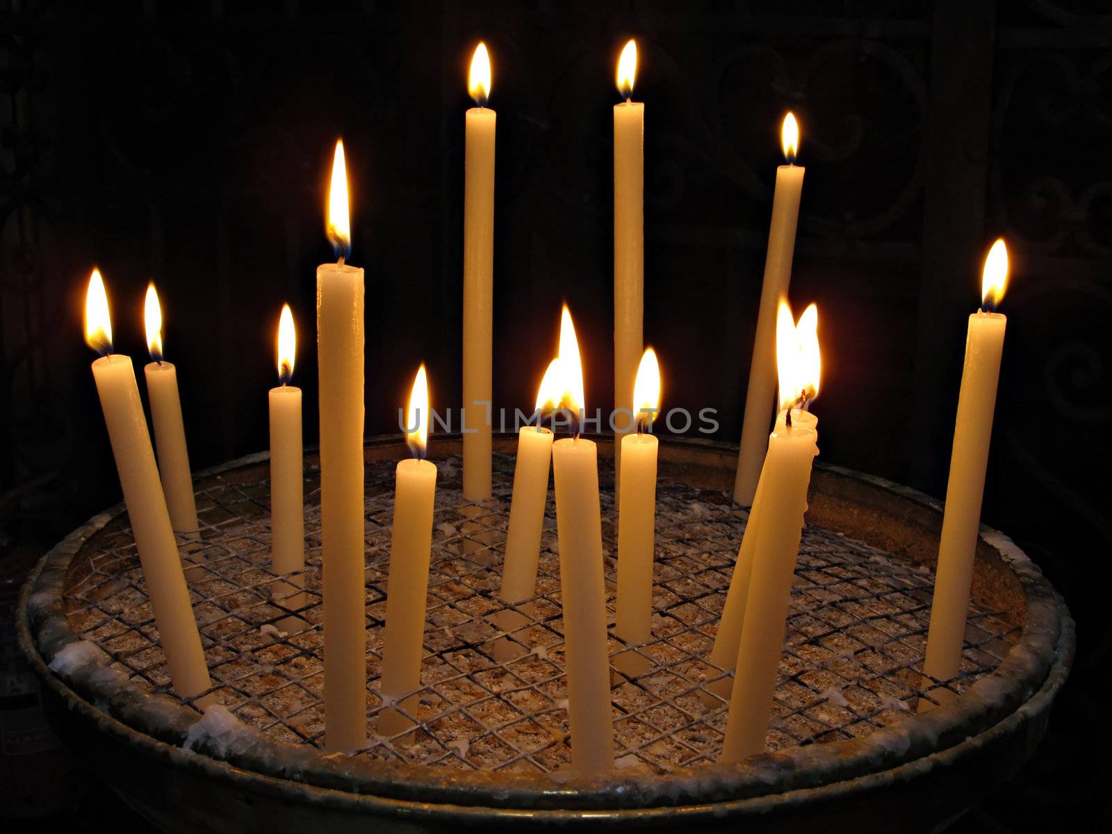 Candles lit for prayer in papal Basilica di Santa Maria in Trastevere