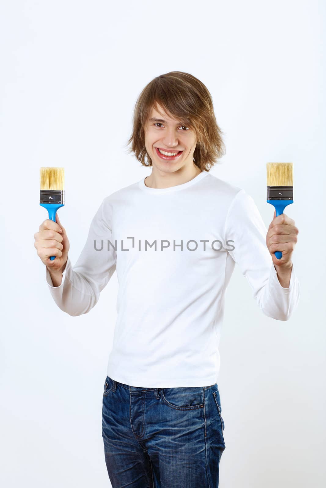 Man with paint brushes by sergey_nivens