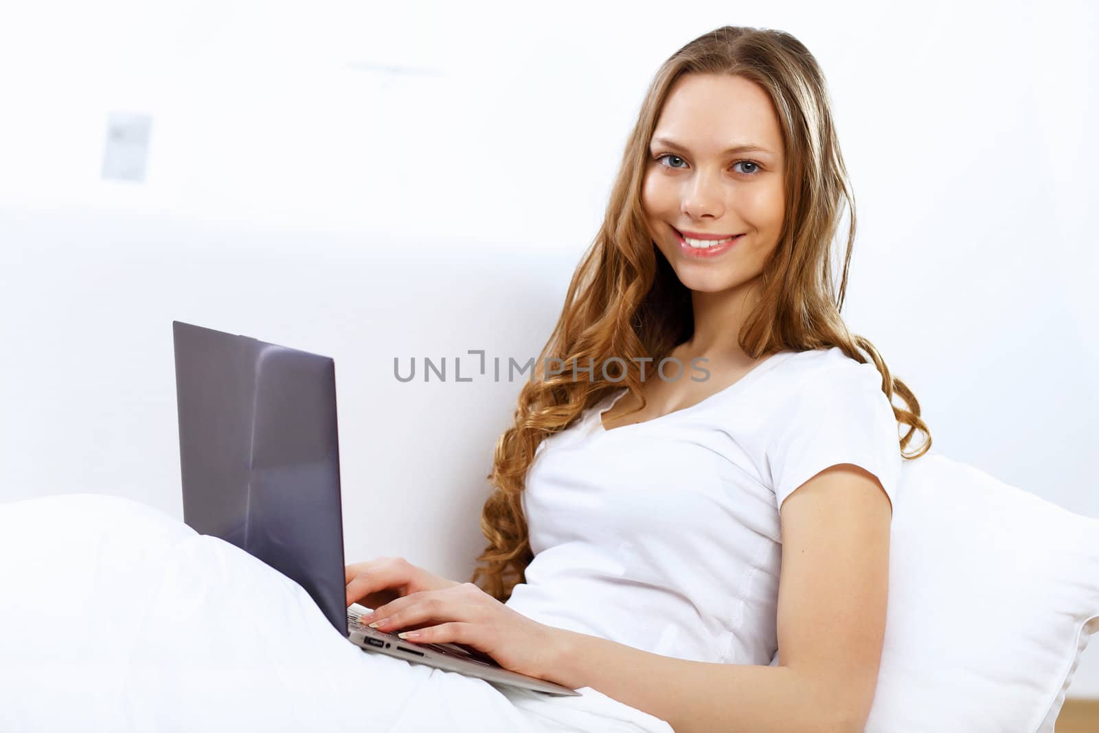 Portrait of young woman sitting with a notebook