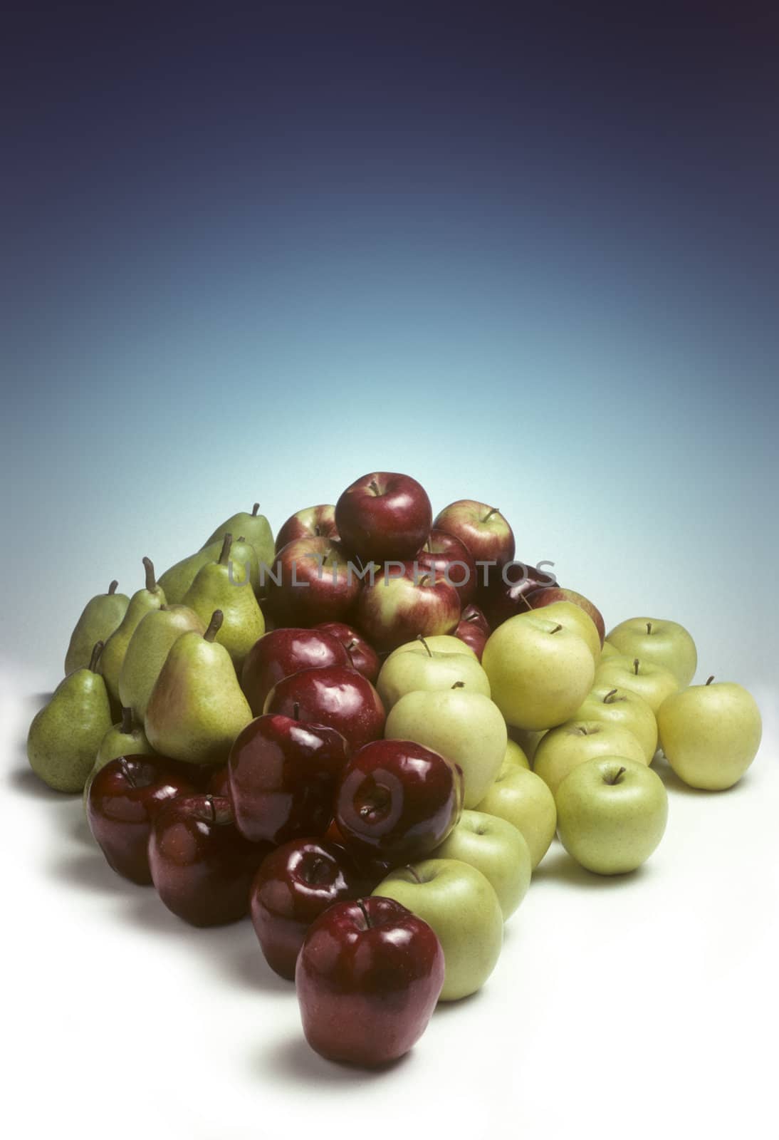 A pile of a variety of apples and pears