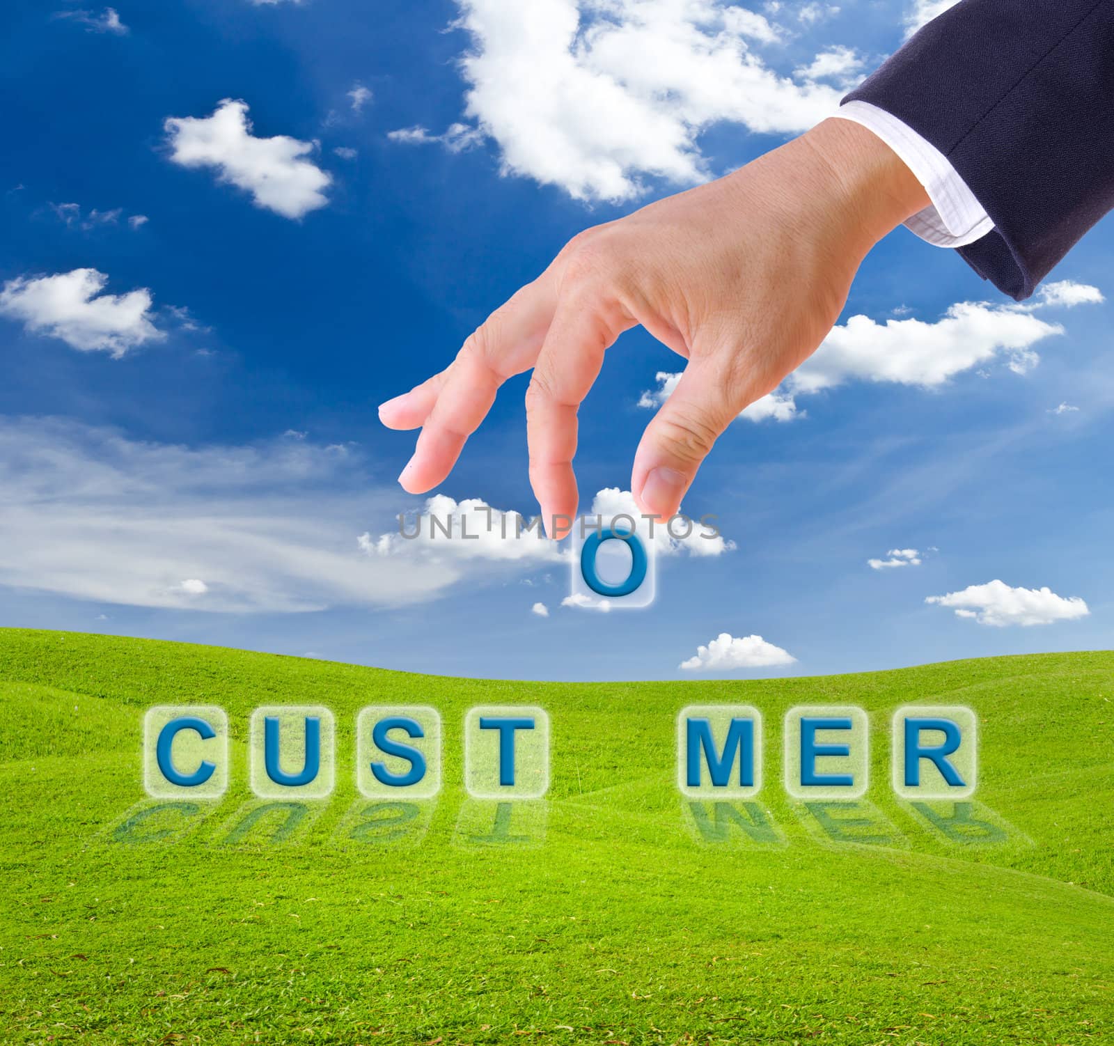business man hand and customer word on green grass meadow