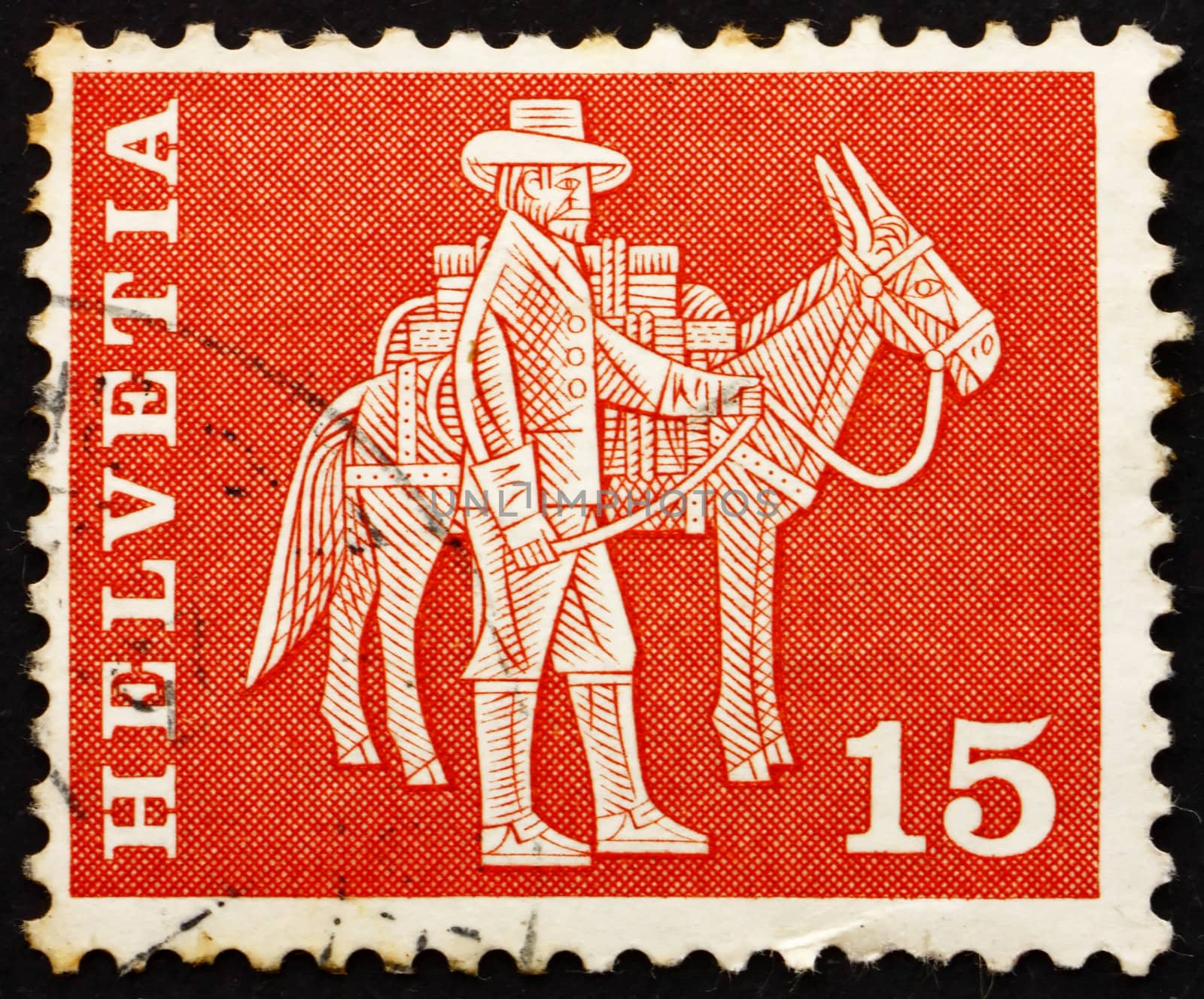 SWITZERLAND - CIRCA 1960: a stamp printed in the Switzerland shows Messenger and Pack Animal, circa 1960