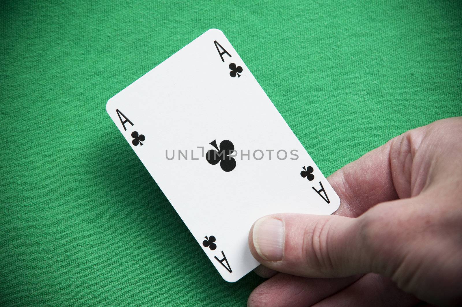 A Colouful Photo of Someone Dealing an Ace Playing Card