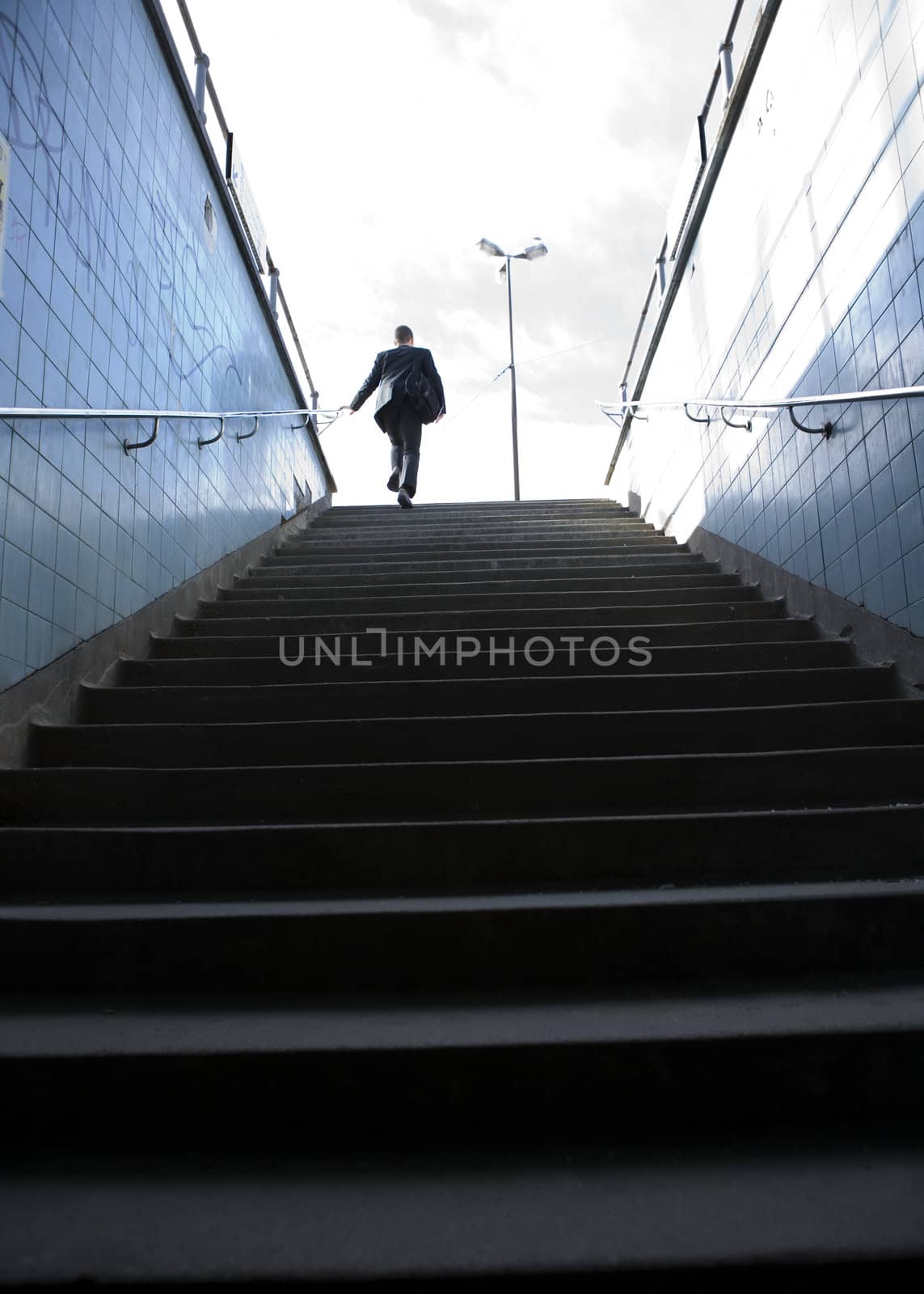 Businessman from behind in stairs
