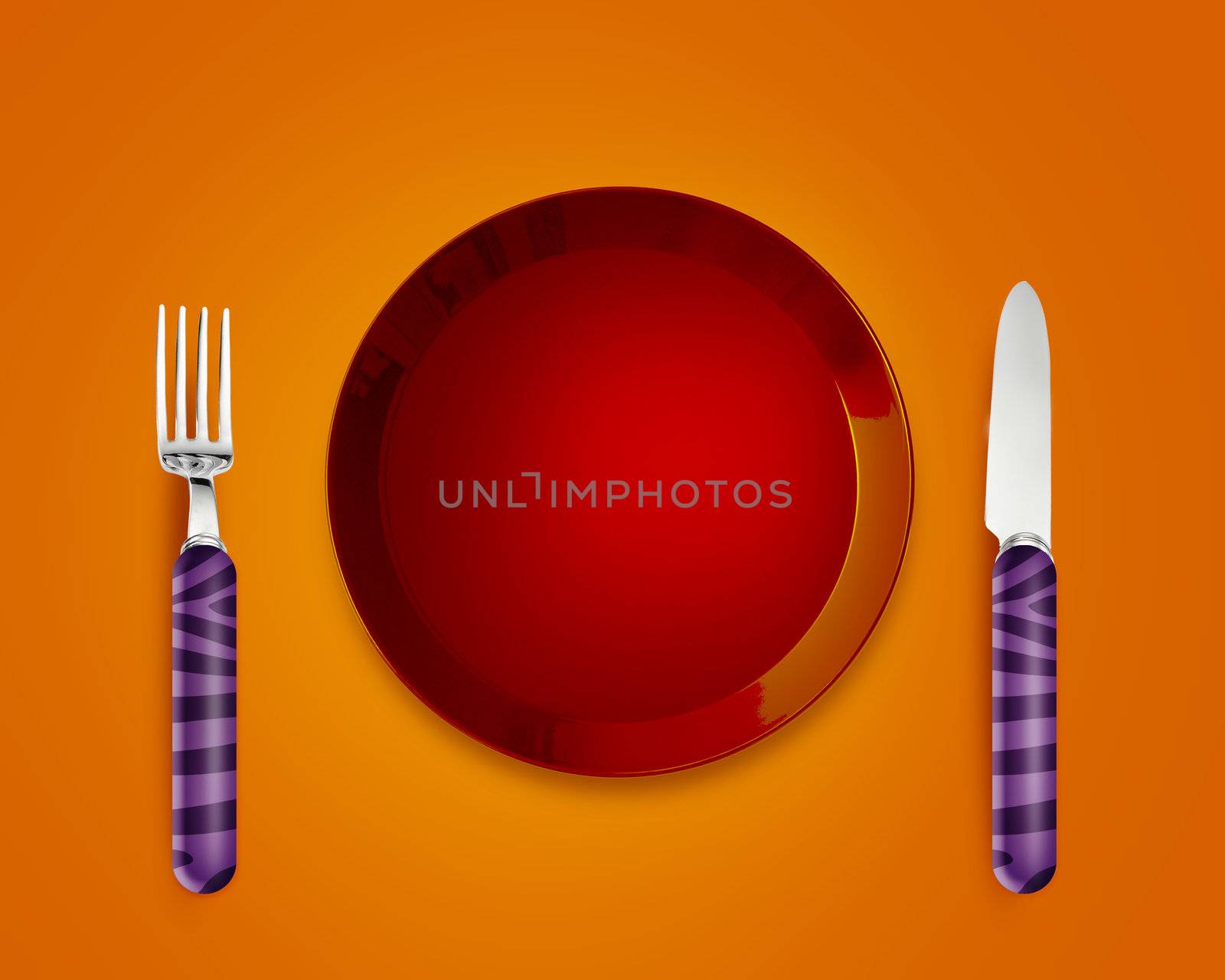 Empty red Plate with knife and fork.