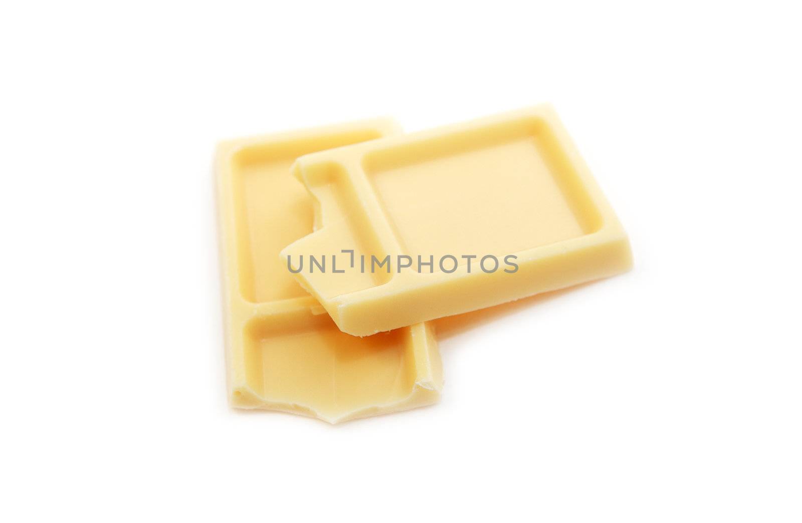 pieces of white chocolate on white background studio isolated