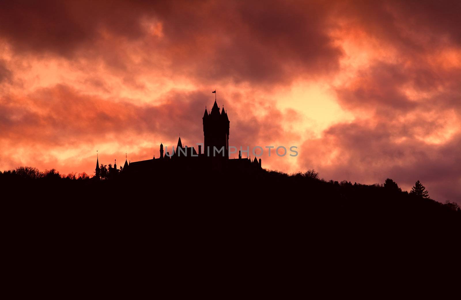 silhouette of the old castle over cloudy sky during sundown