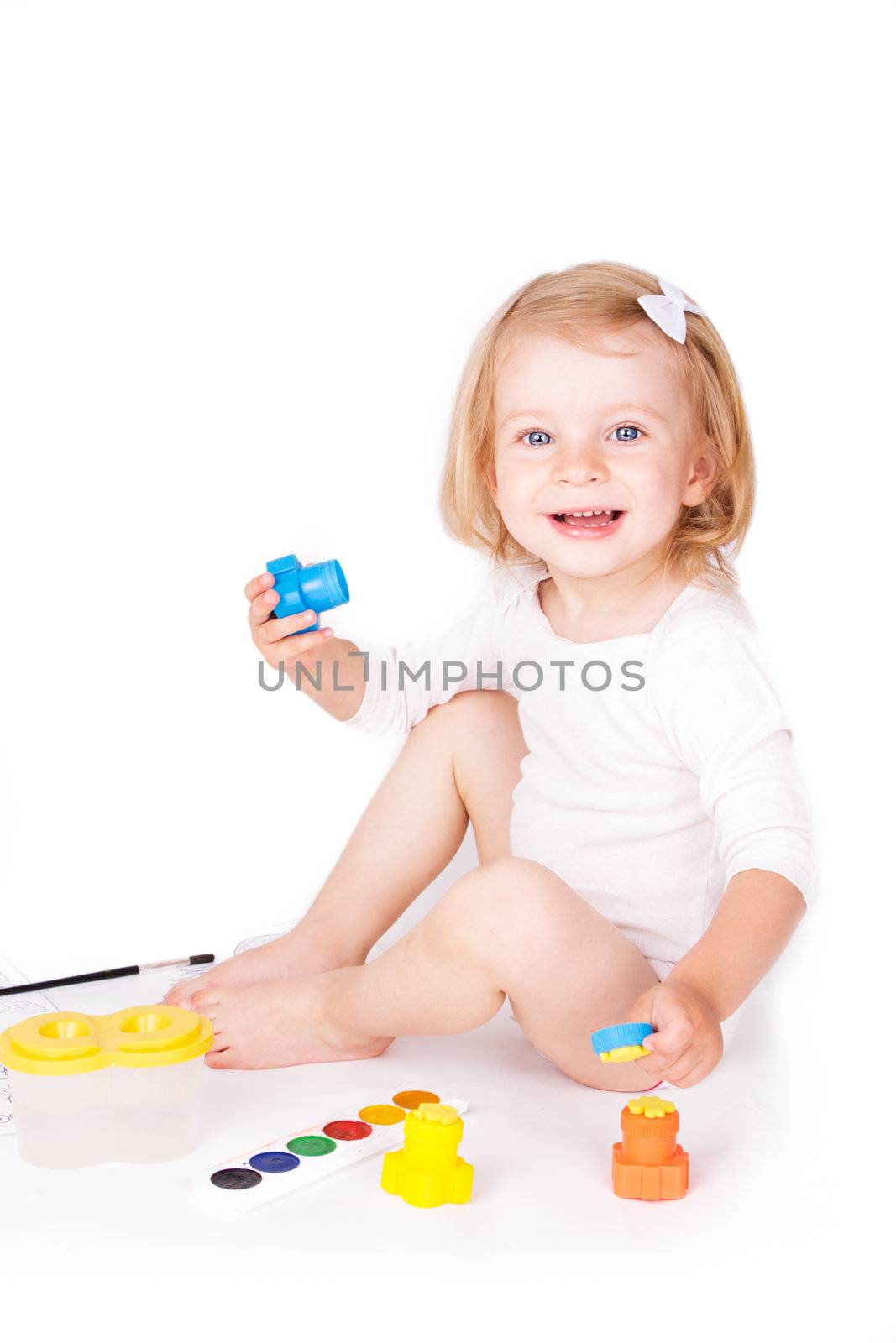 Happy girl painting isolated on white