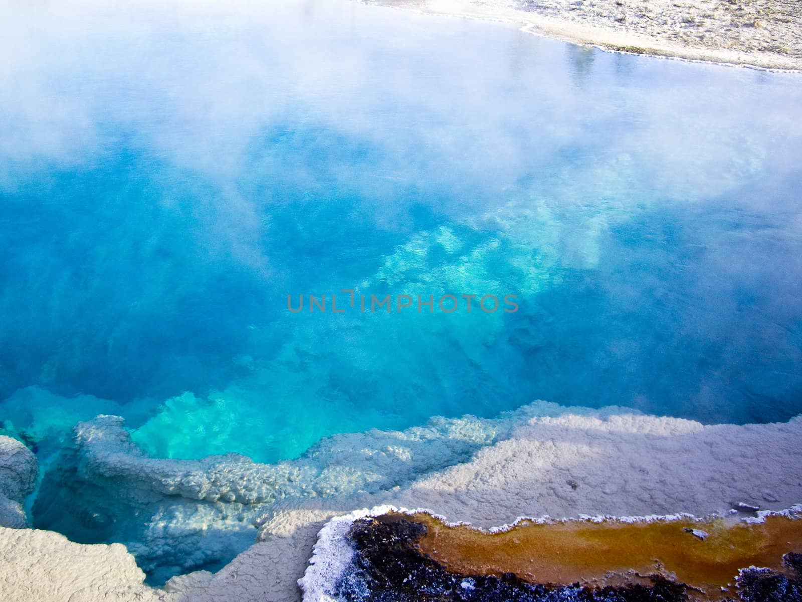 Steaming blue thermal pool Yellowstone  by emattil