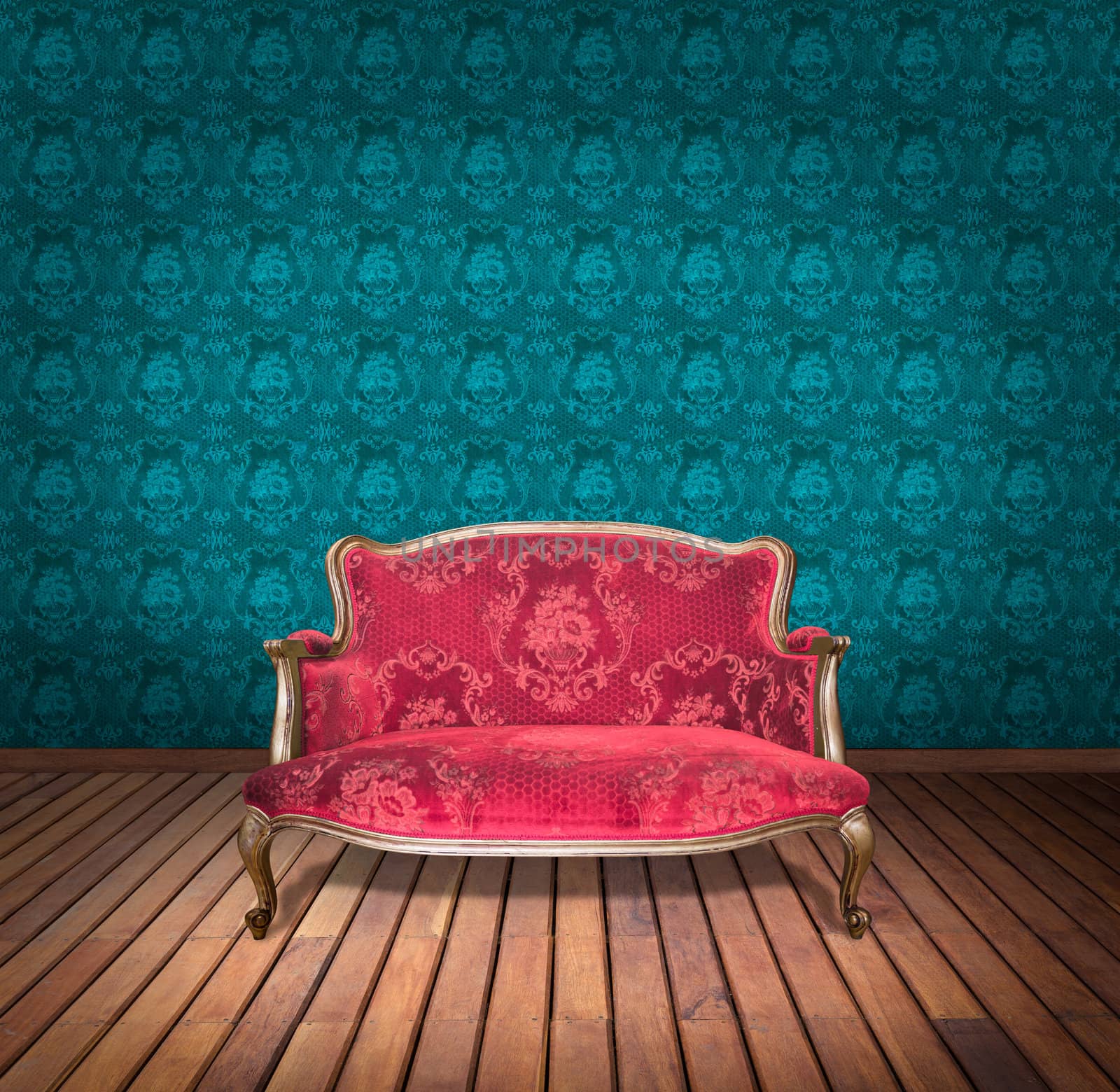 vintage red luxury armchair and in blue wallpaper room by tungphoto