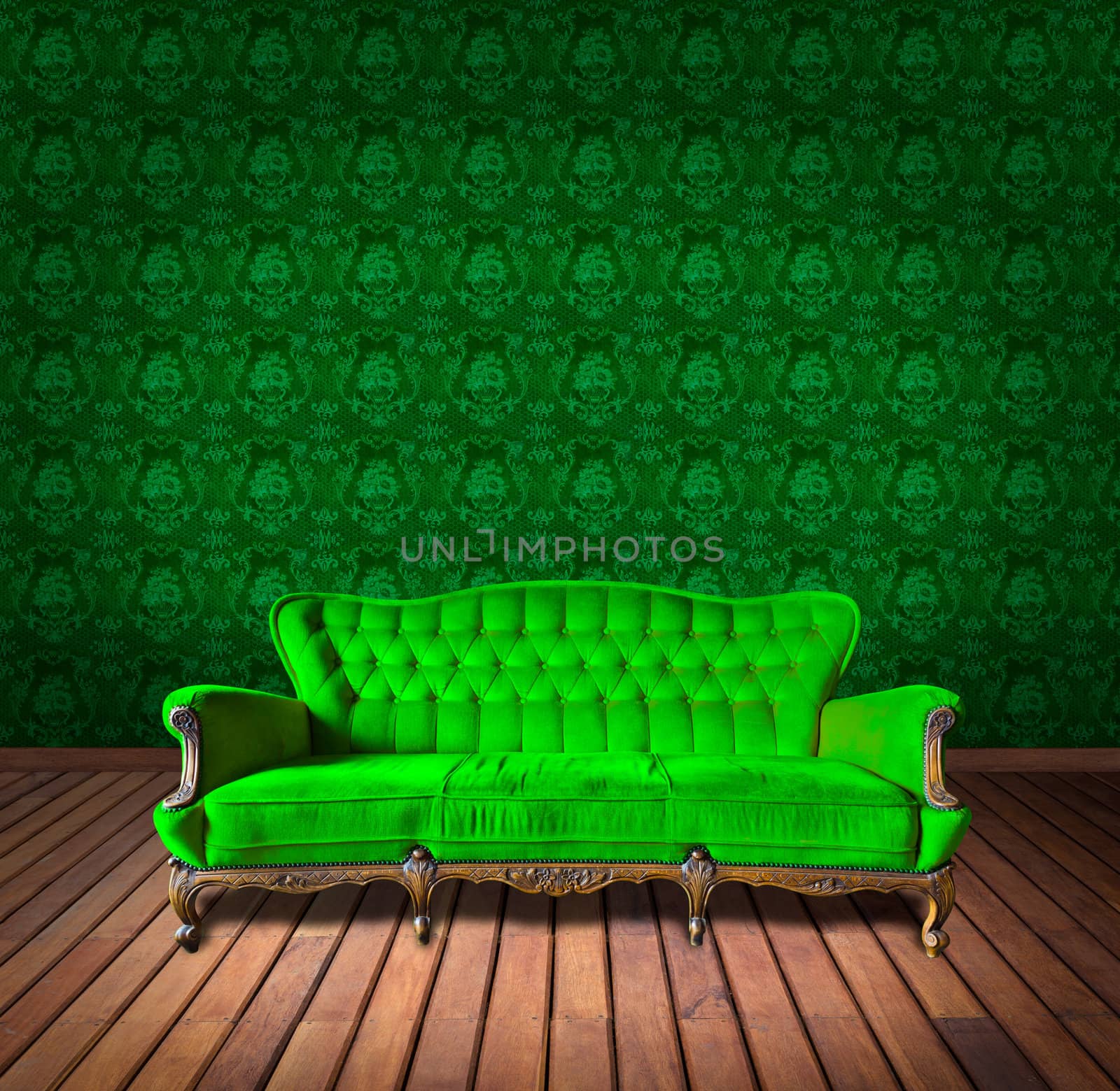 vintage luxury armchair and in green wallpaper room by tungphoto