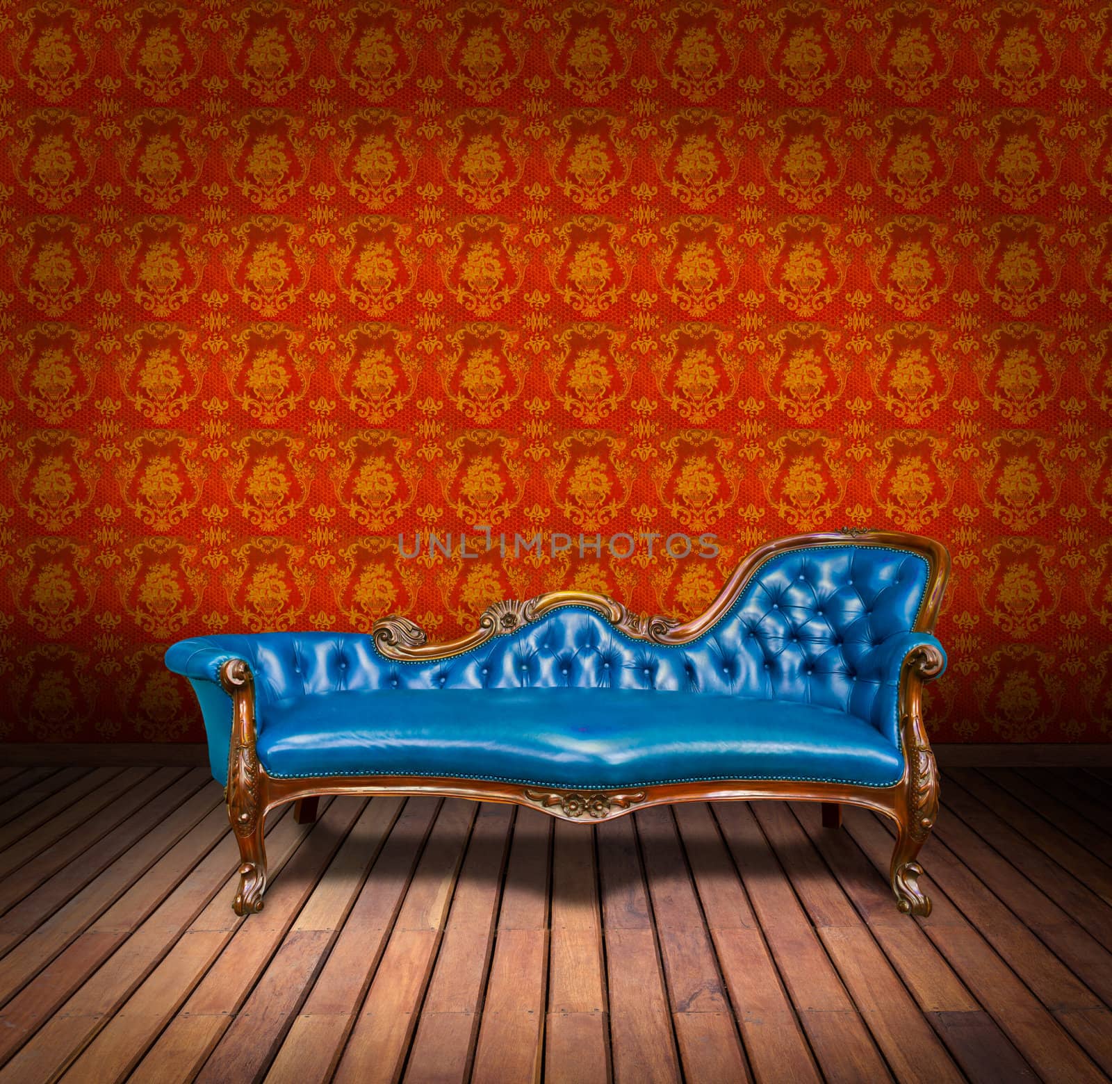 vintage blue luxury armchair and in yellow wallpaper room by tungphoto