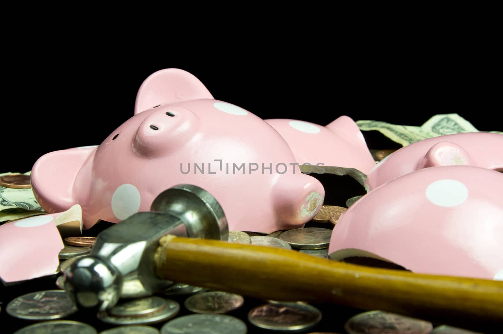 Broken piggy bank with cash & coins