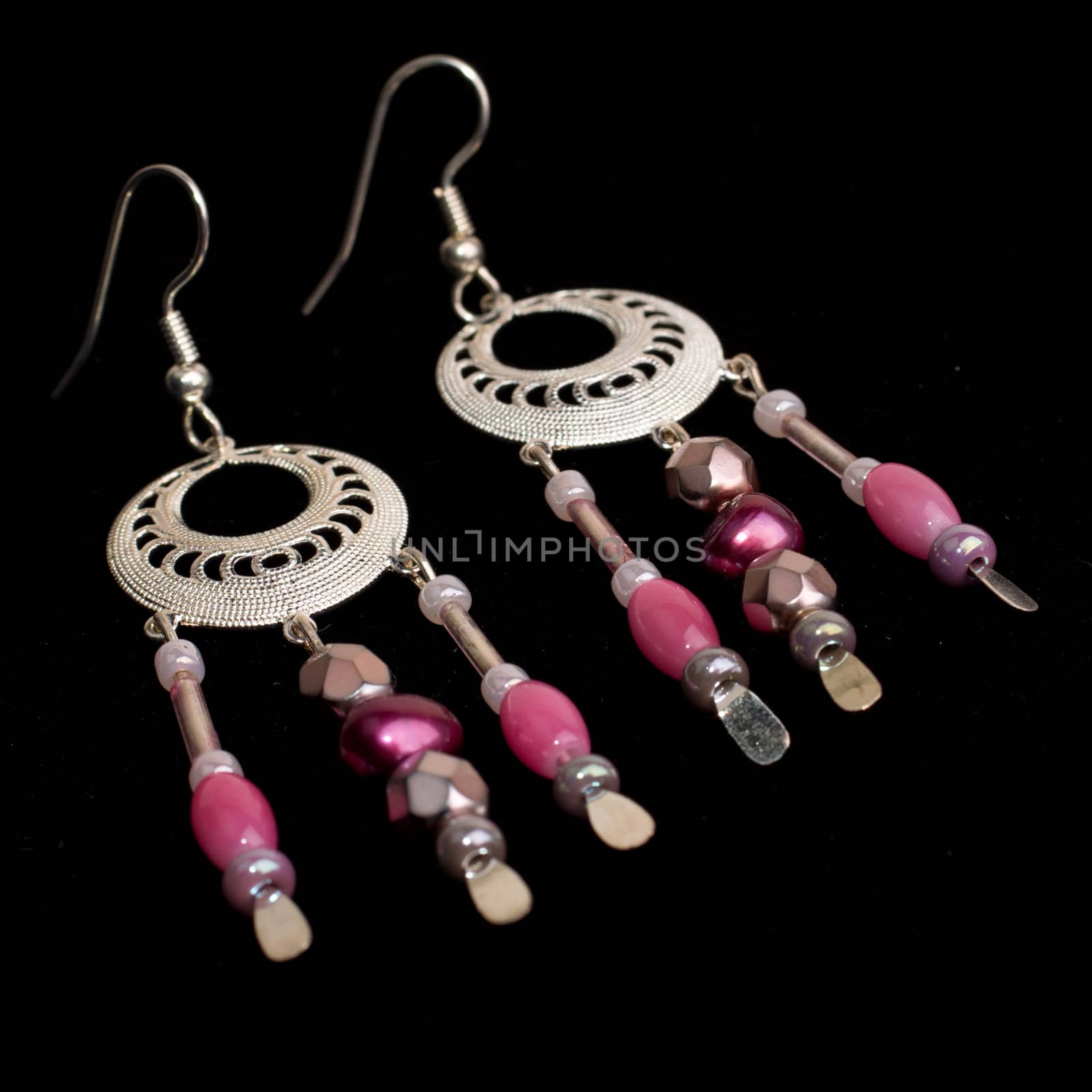 Handmade beaded earrings isolated on black background
