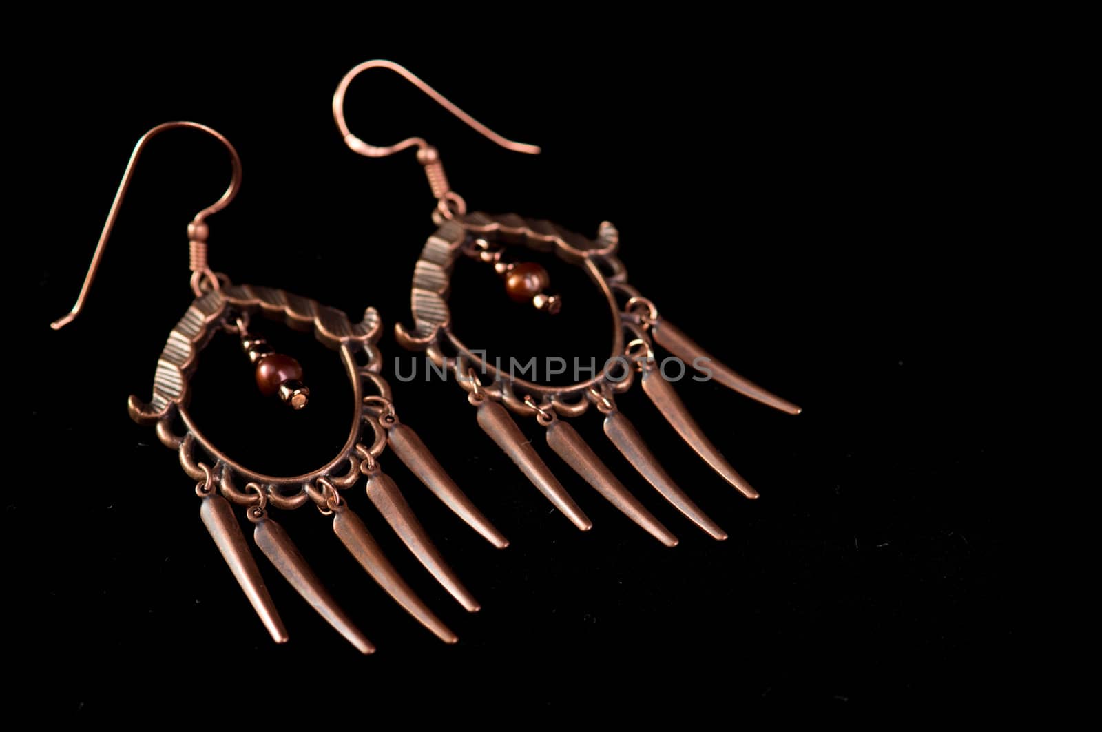 Handmade beaded earrings isolated on black background