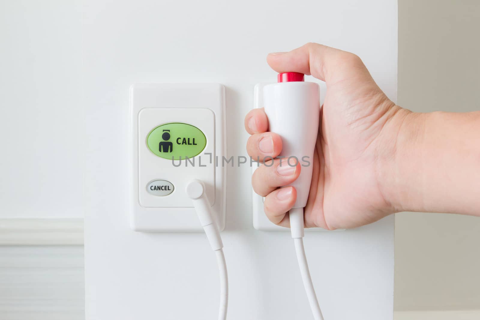 hand pushing nurse call button  by tungphoto