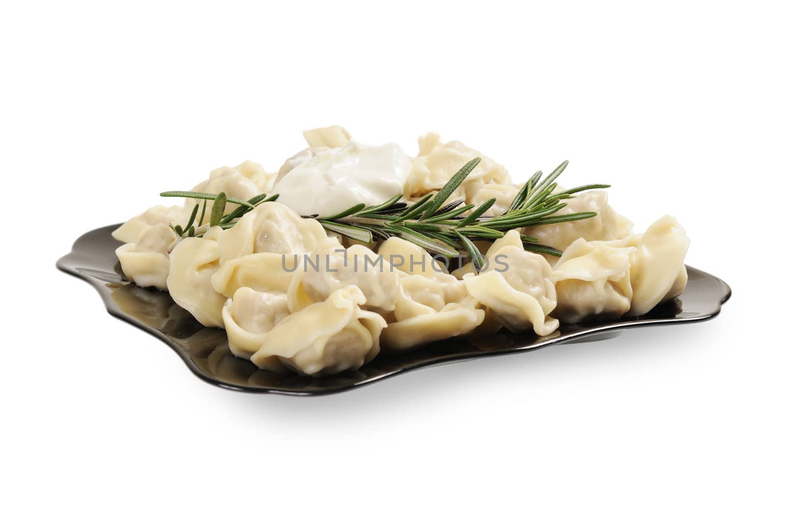 Ready to eat ravioli on a plate. Decorated with rosemary. Isolated on white.