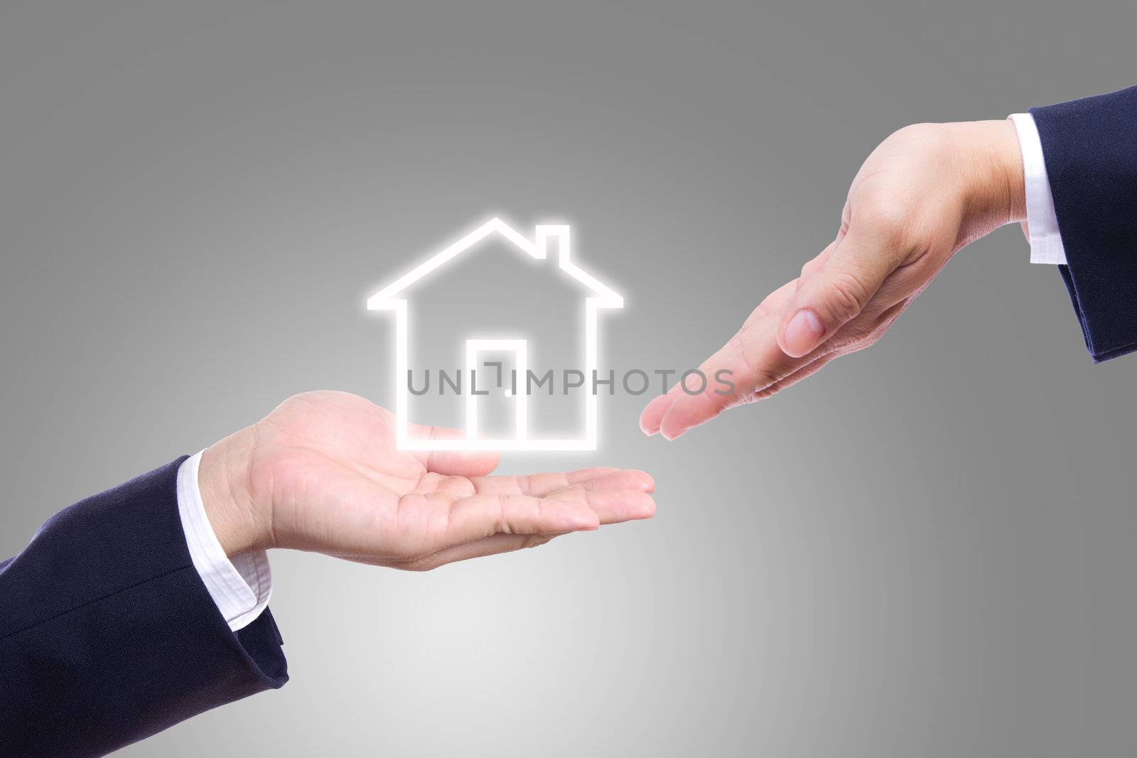 business man hand giving house  by tungphoto