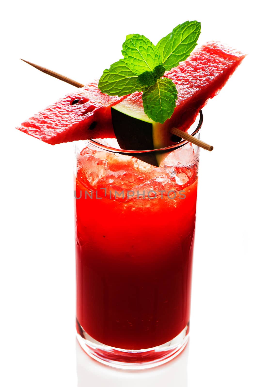 Watermelon smoothie garnished with watermelon slices and mint leaves isolated on white