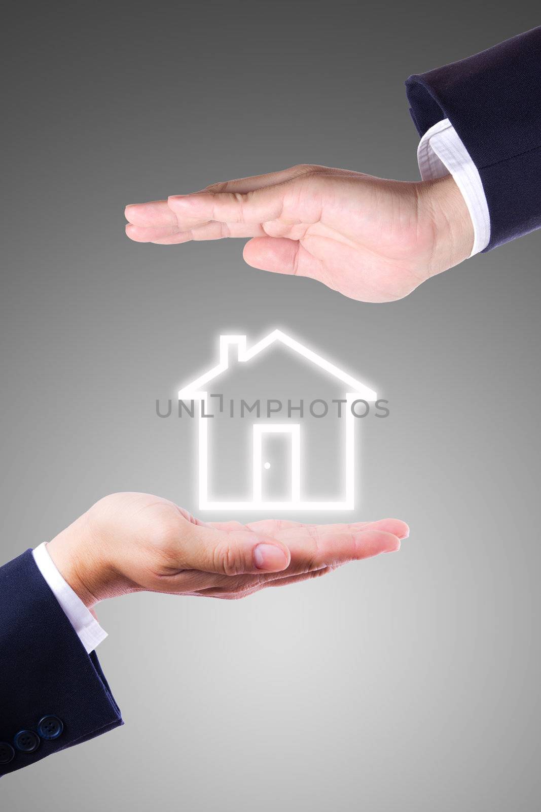 business man hand giving house icon by tungphoto