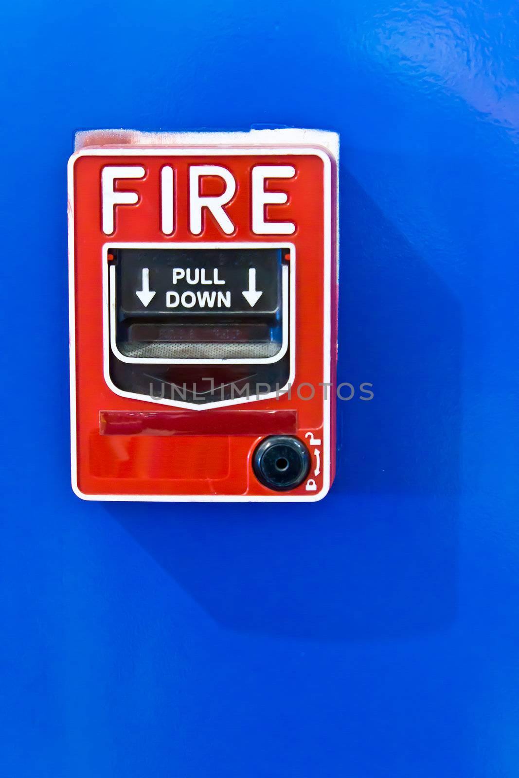 fire alarm switch on blue wall by tungphoto