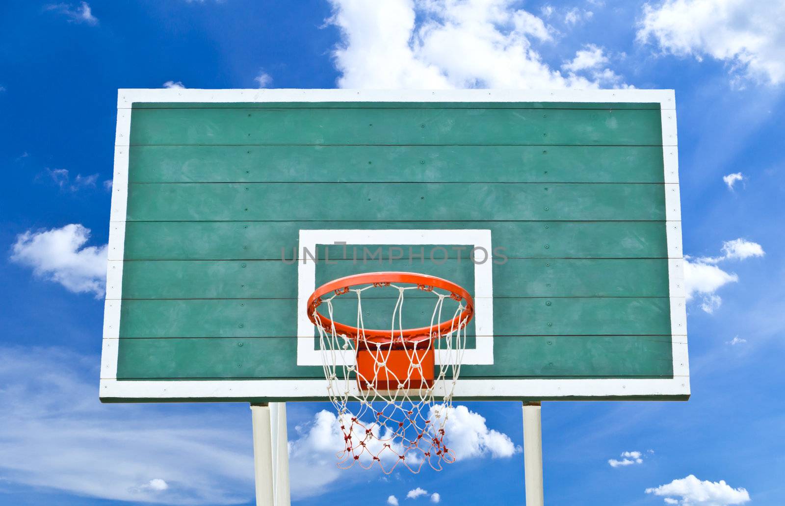 basketball hoop against blue sky by tungphoto