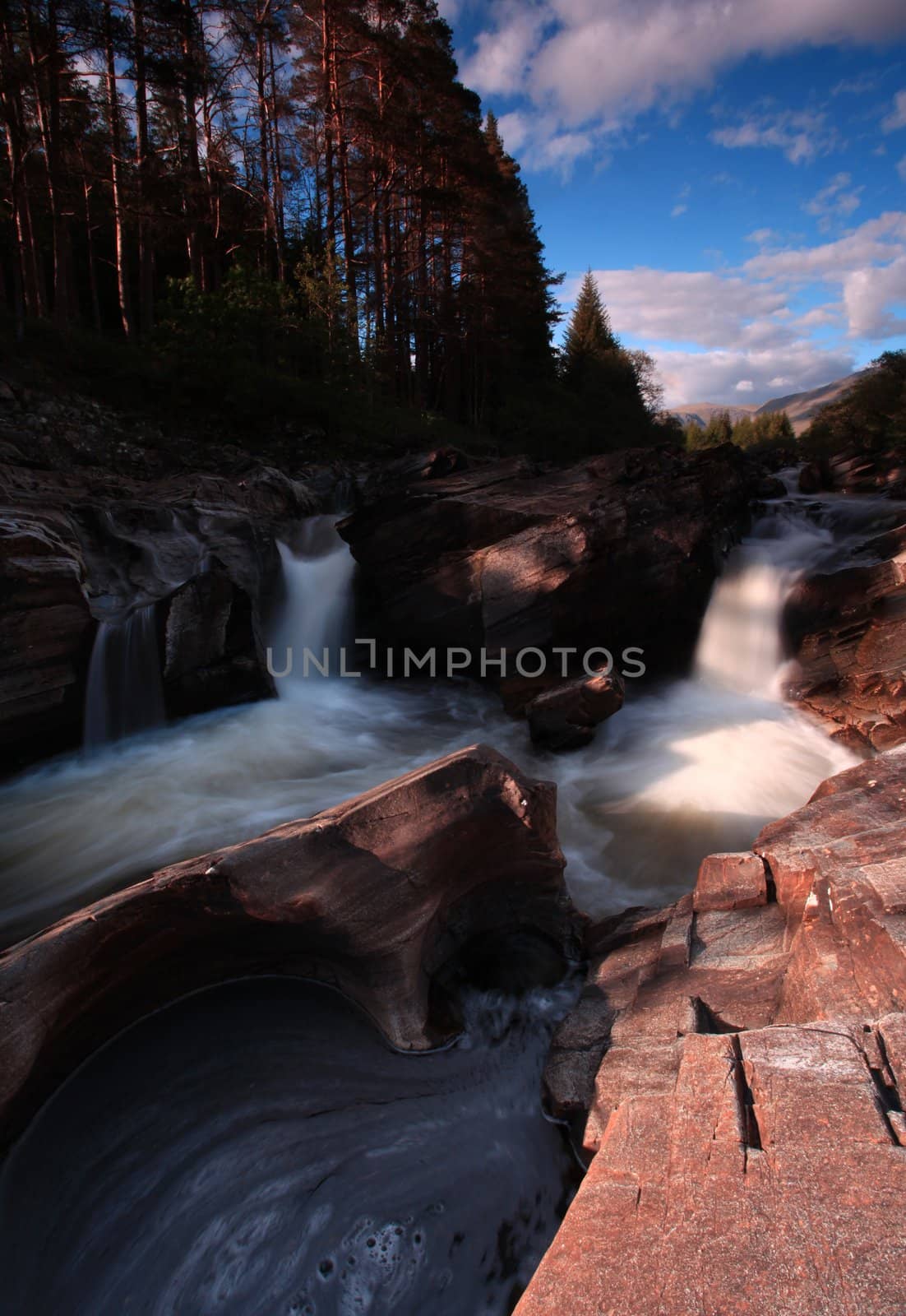 Waterfall in the Scotish Highlands by olliemt