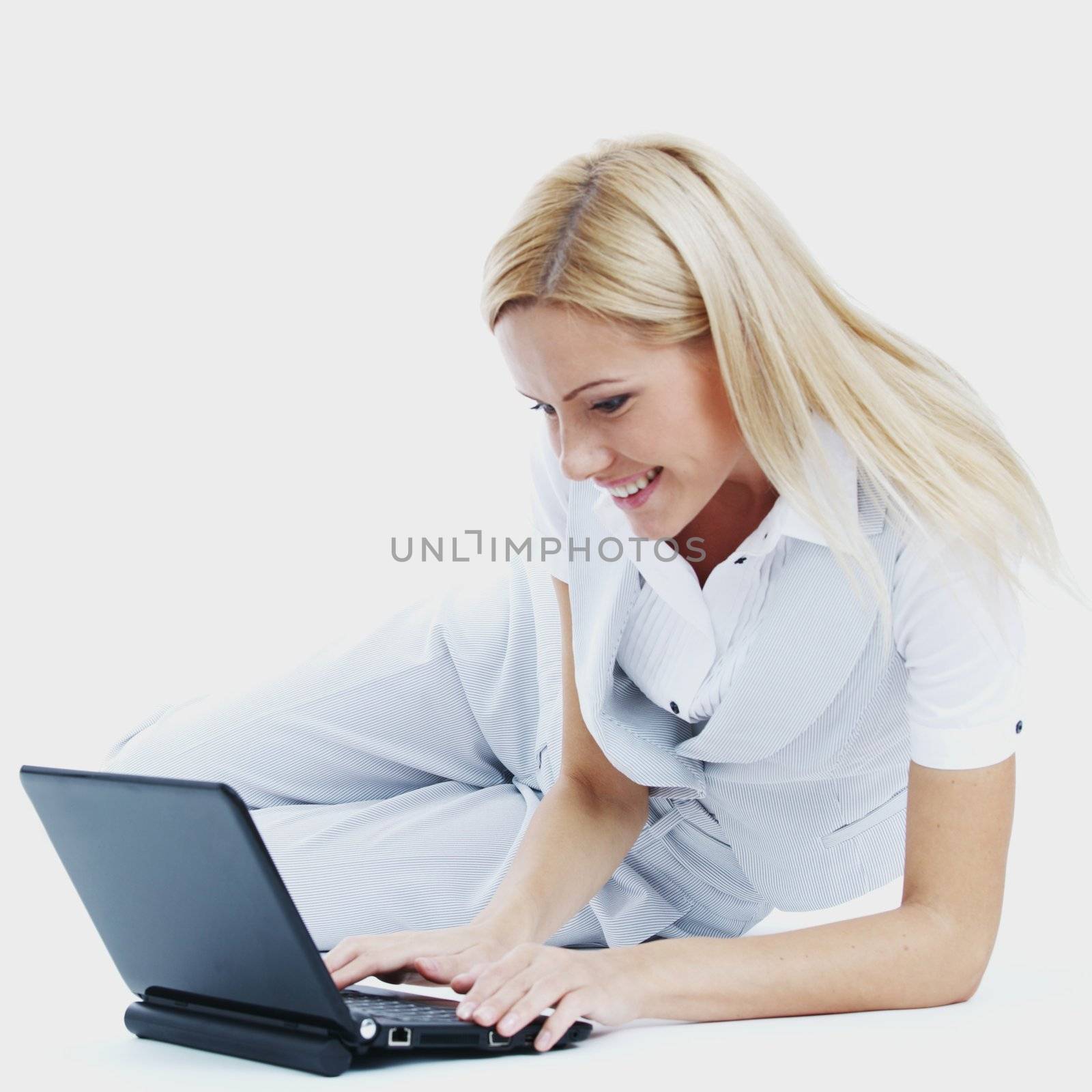 business woman lies and working on laptop