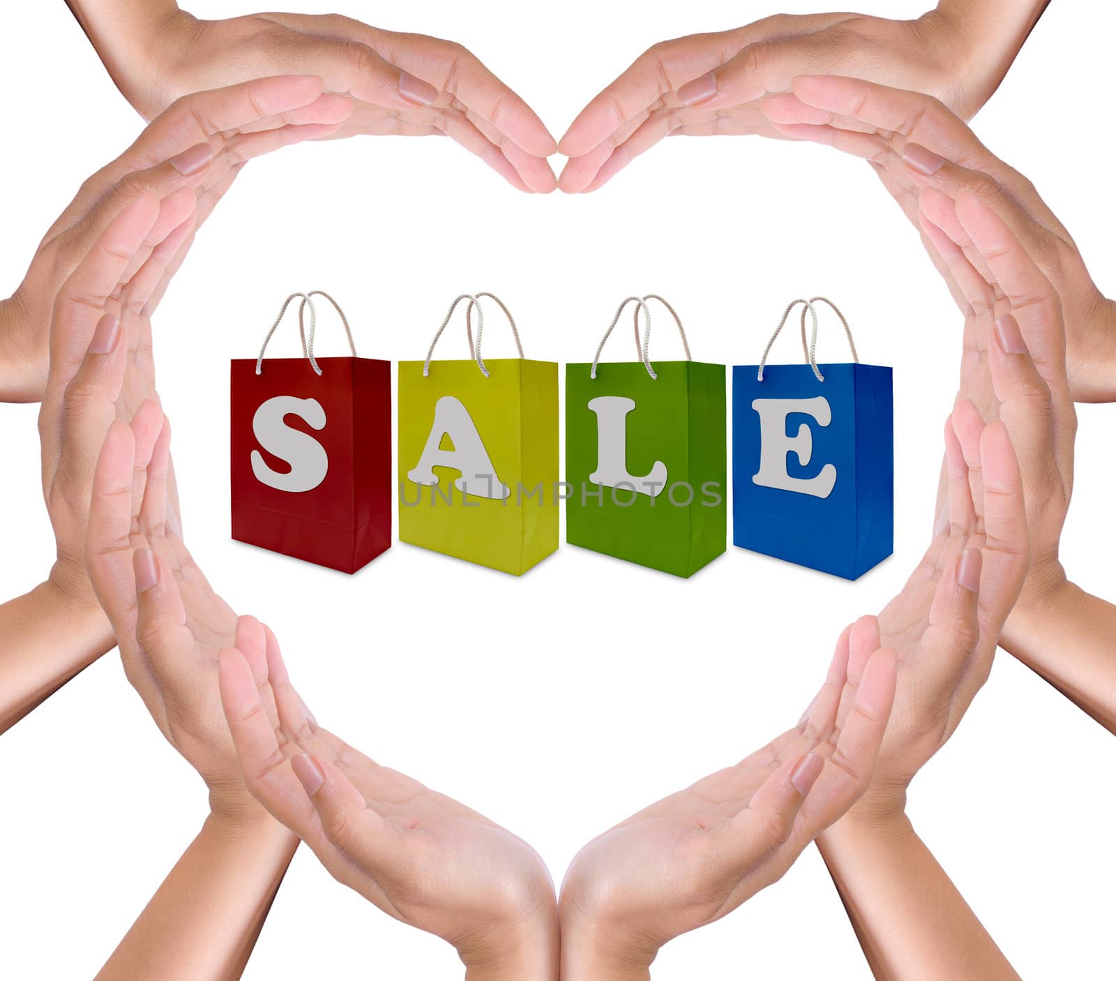 sale label on shopping  paper bag in hands heart