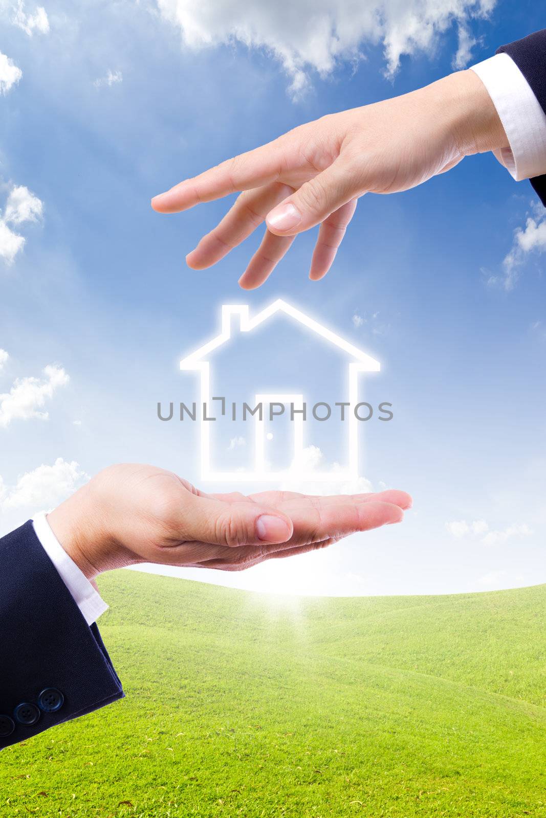 house icon on hand by tungphoto