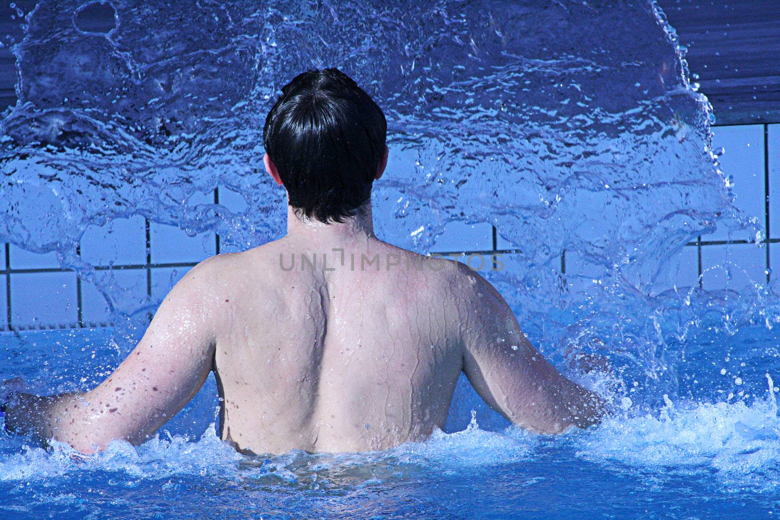 man in swimming pool by photochecker