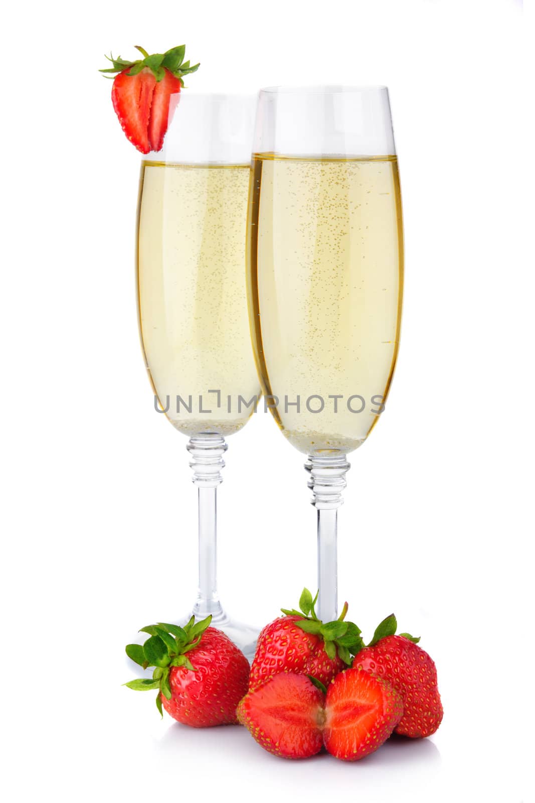 Two glasses of champagne and fresh strawberry isolated on white by alphacell