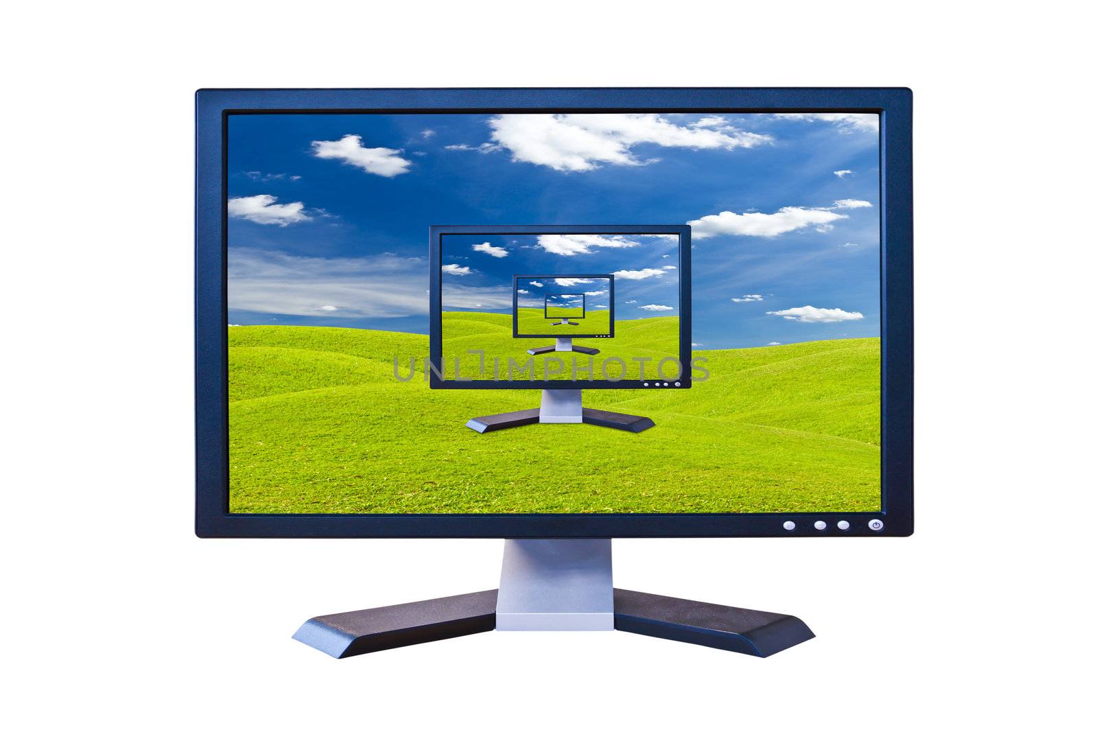Lcd monitor on green grass meadow
