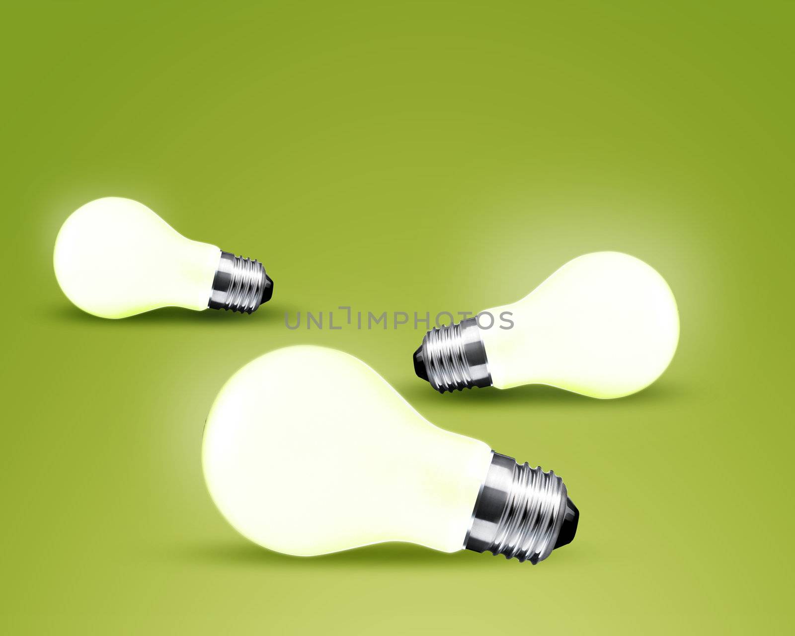 Three glowing Light bulb idea on green background