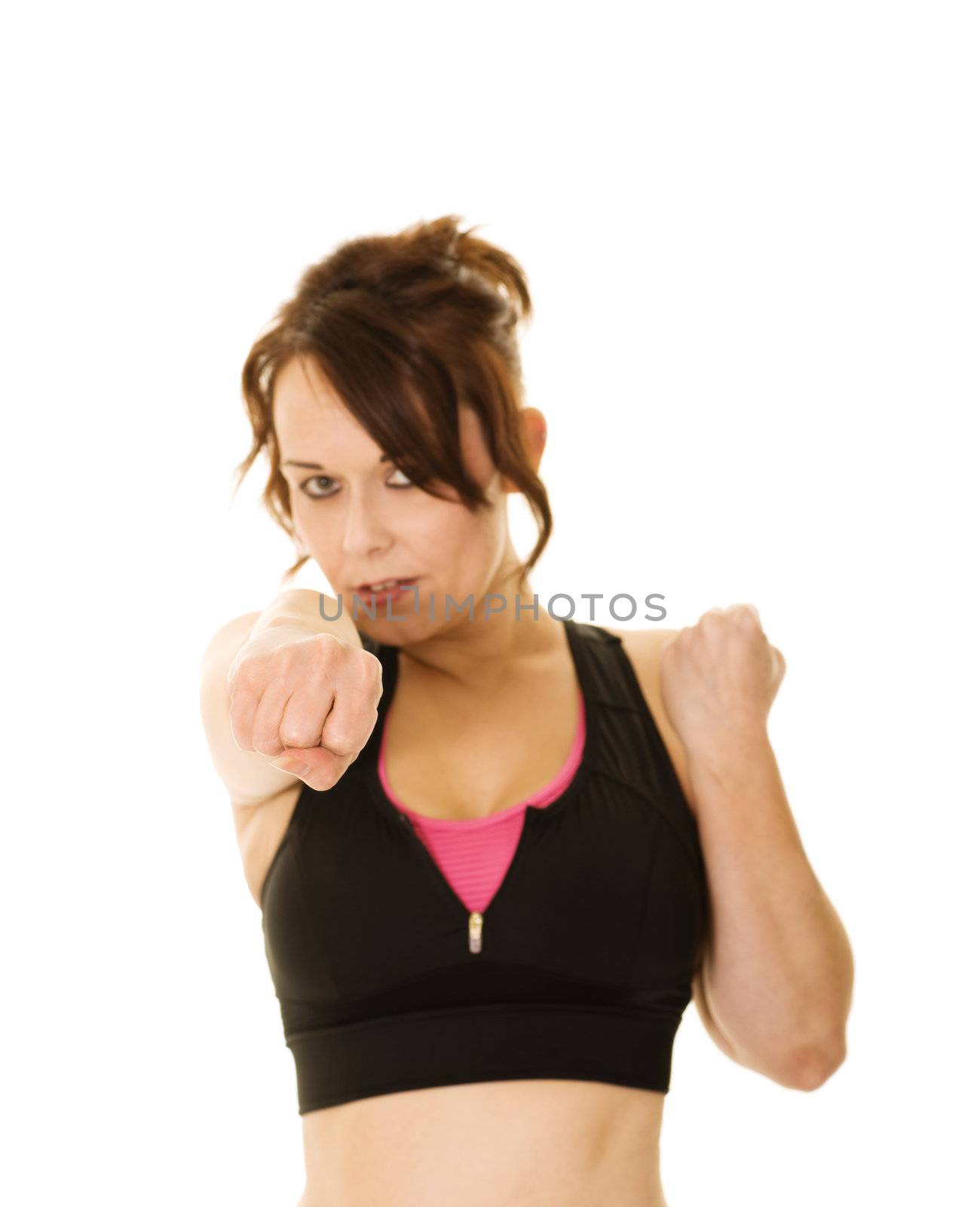 woman punching during workout with shallow depth of field isolated on white