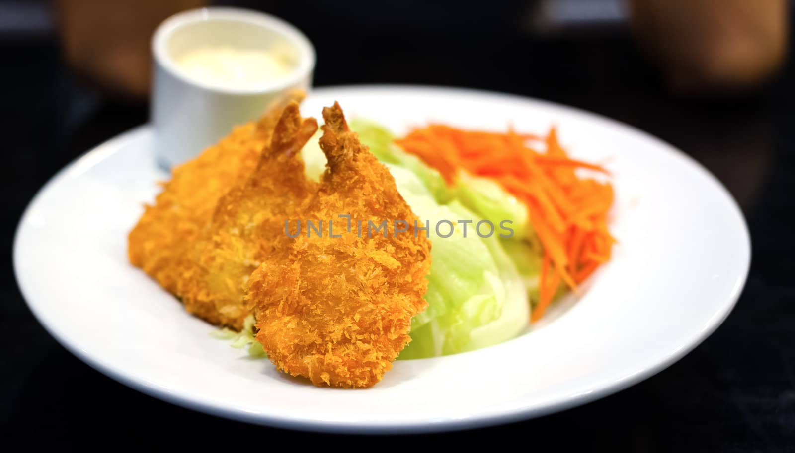 Fried shrimp salad food on white dish