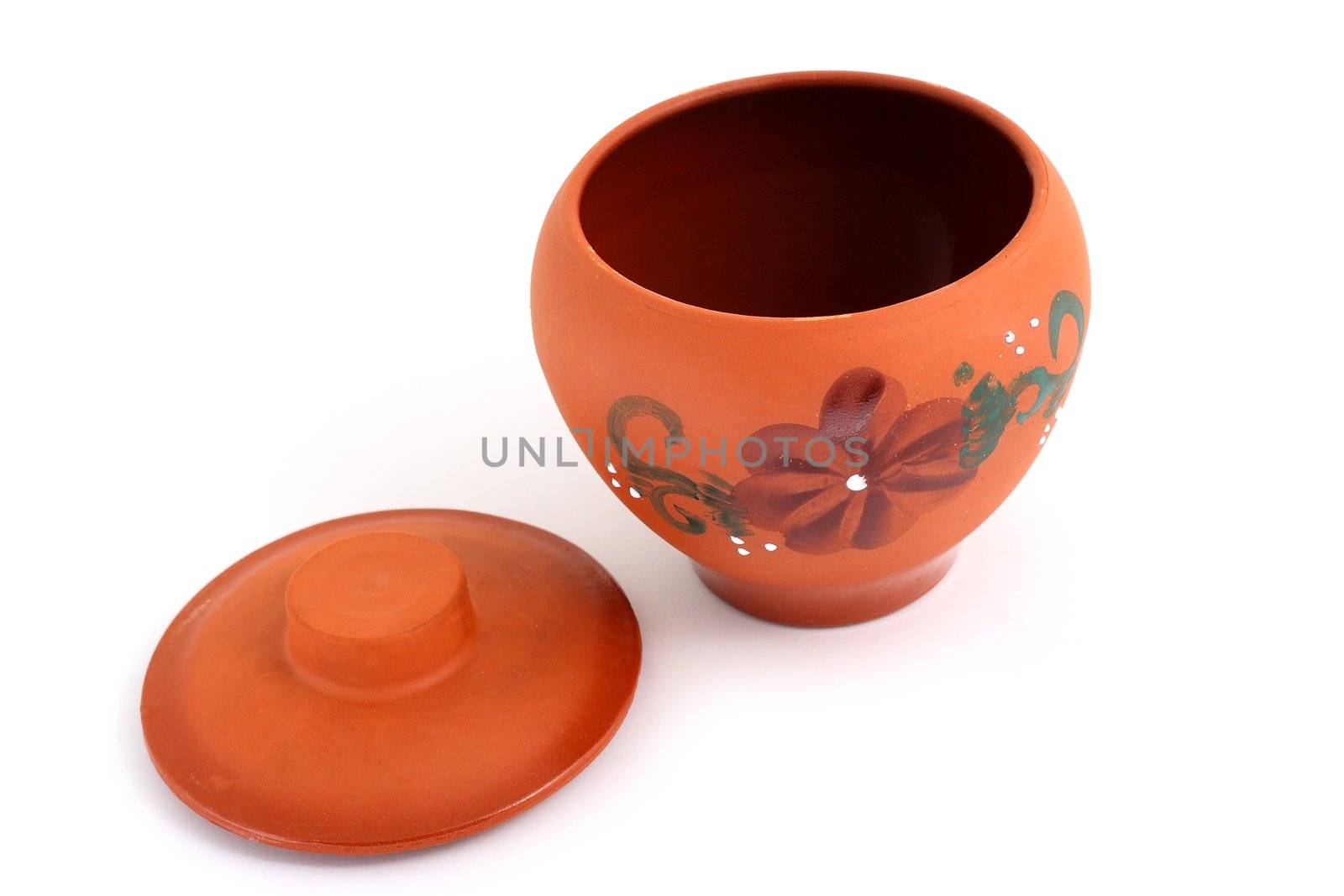 Orange clay pot with a pattern for meal preparation