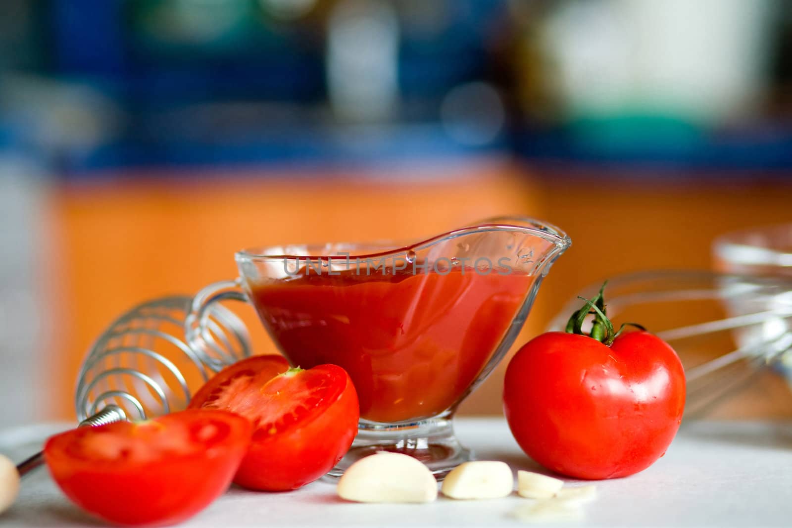 Appetizing  tomatoes and garlic while preparing a poignant sauce

