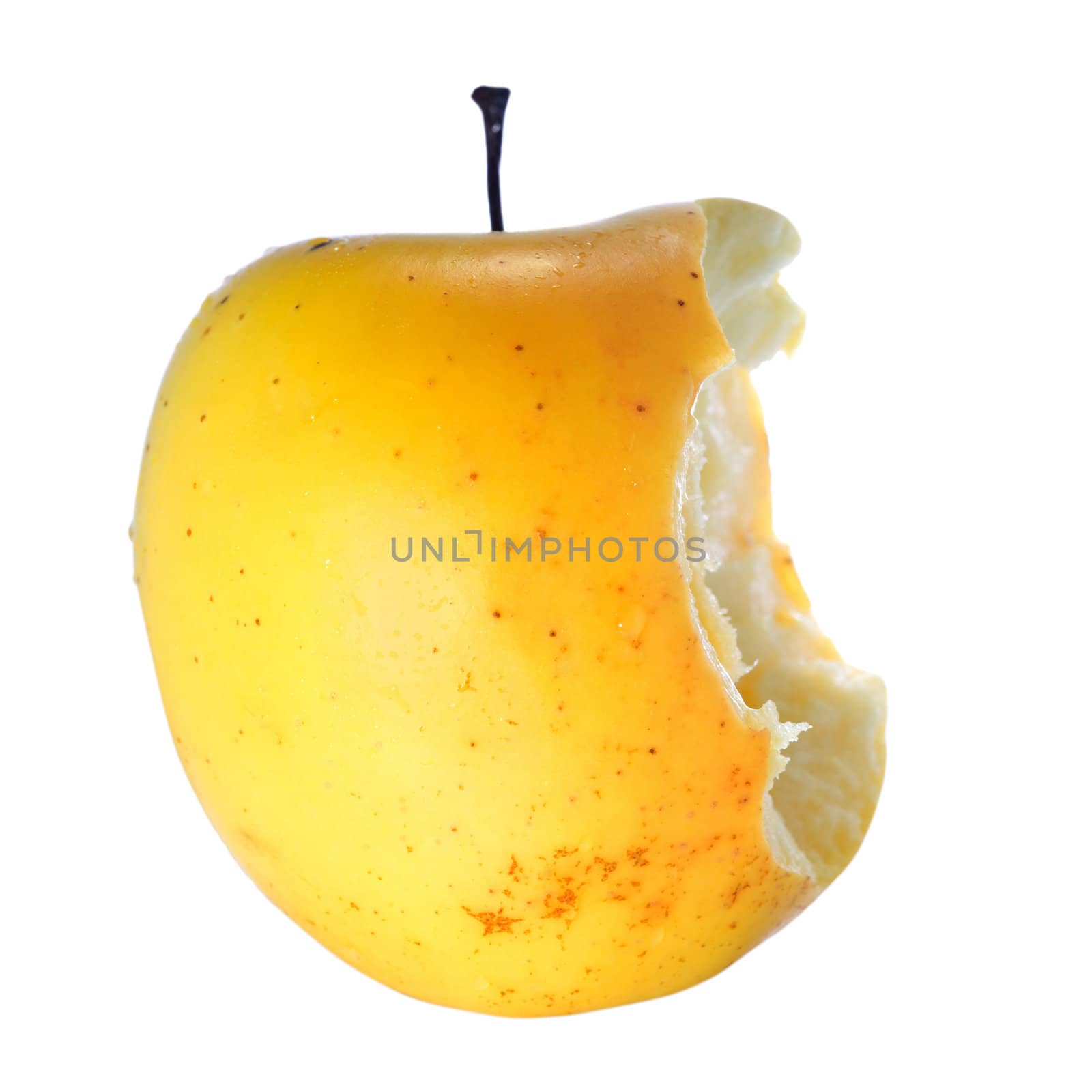 Stock photo: an image of a big yellow apple half eaten