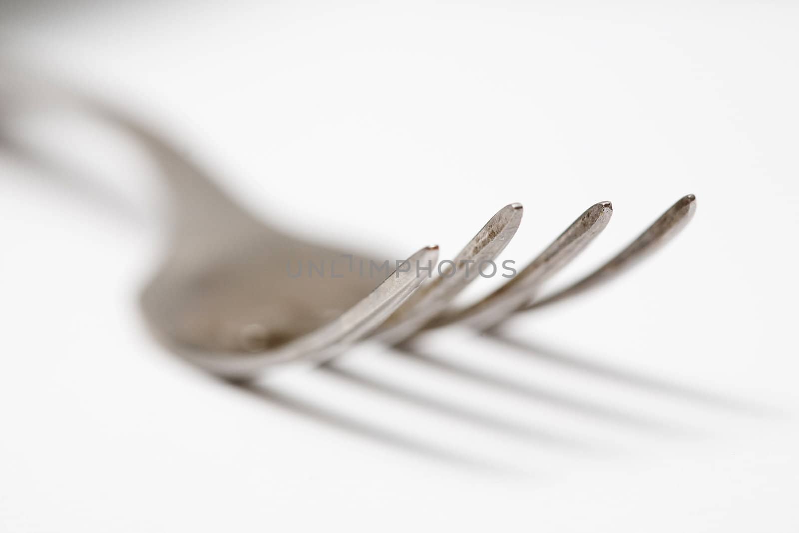 Stock photo: food theme: an image of big steel fork closeup