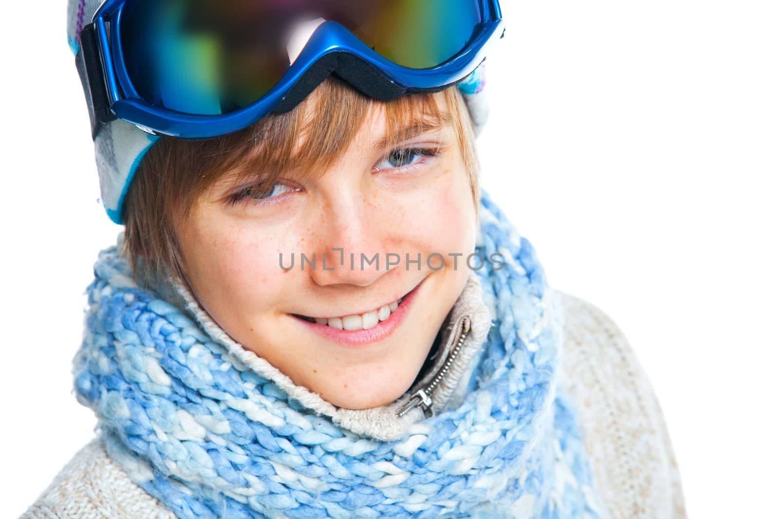 Clouse up portrait of a caucasian cute teenager in ski goggles and a scarf, isolated on white. Vertical view