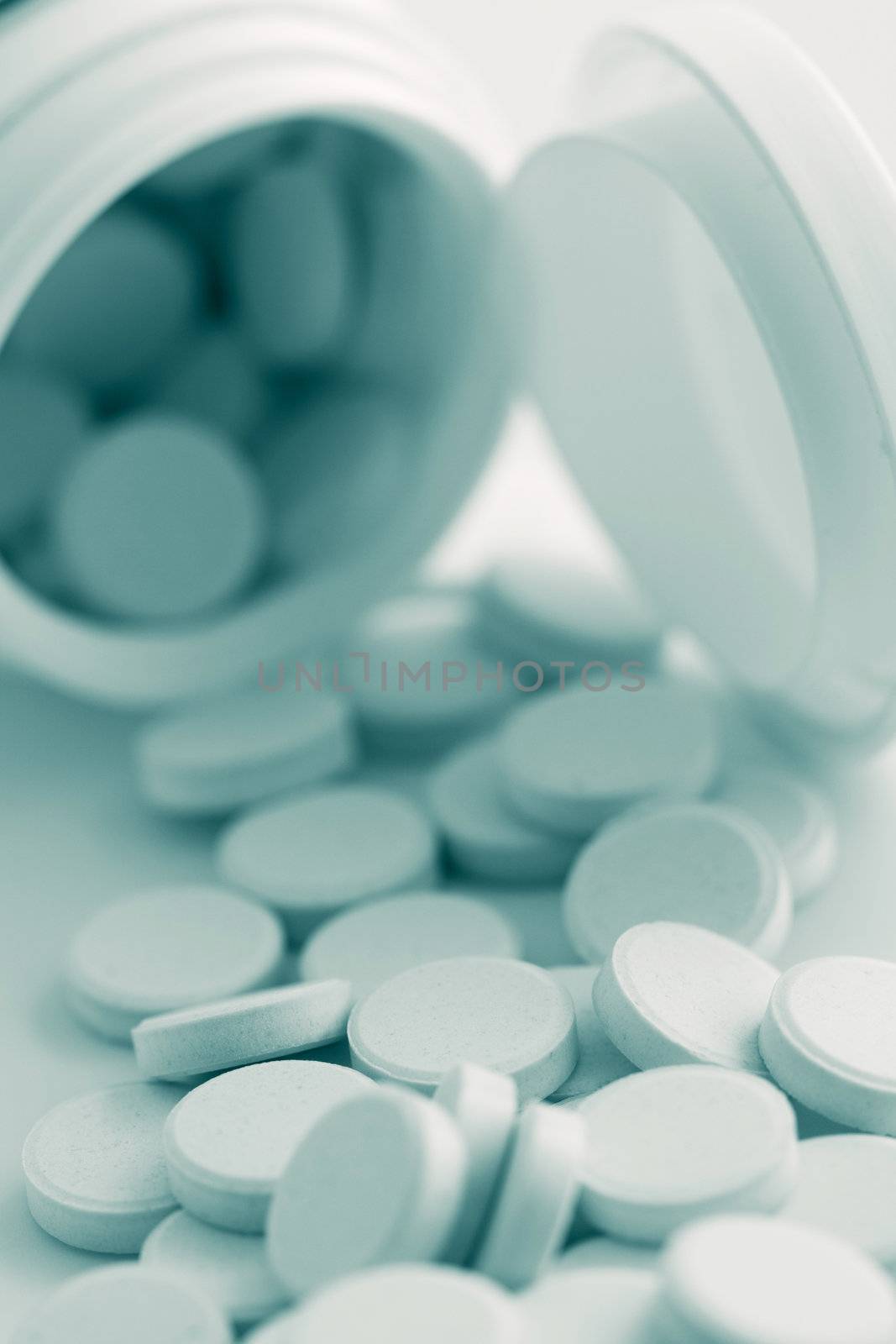 pills spilling out of bottle