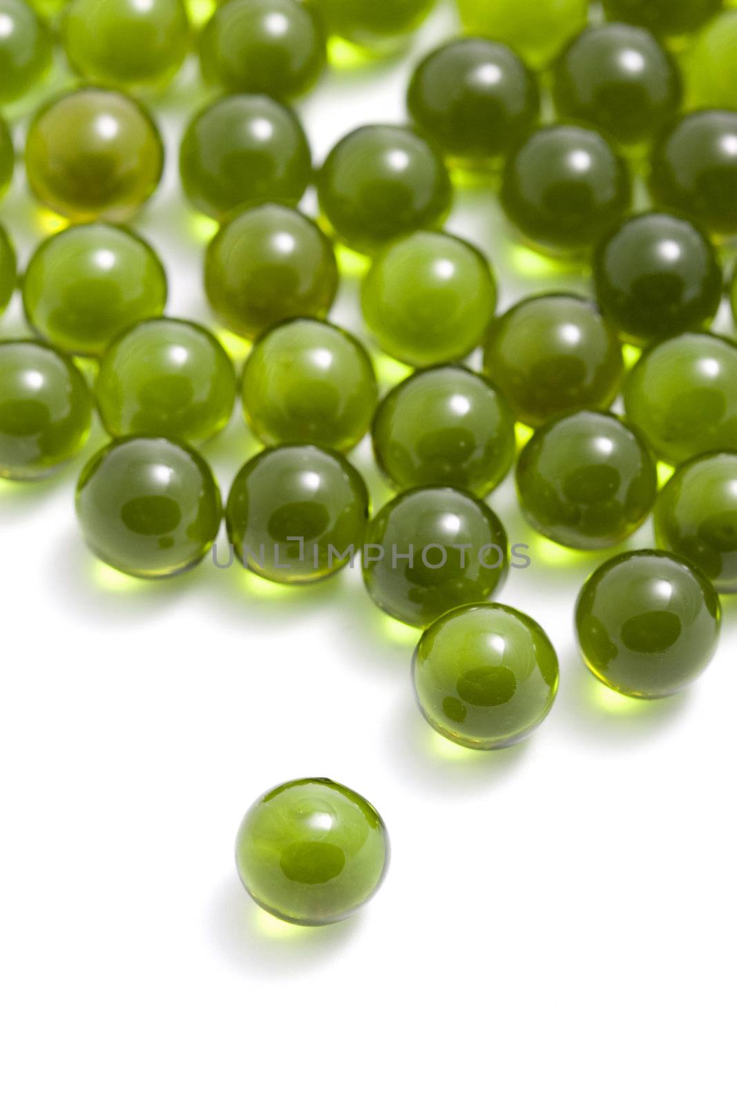 green capsule pills isolated