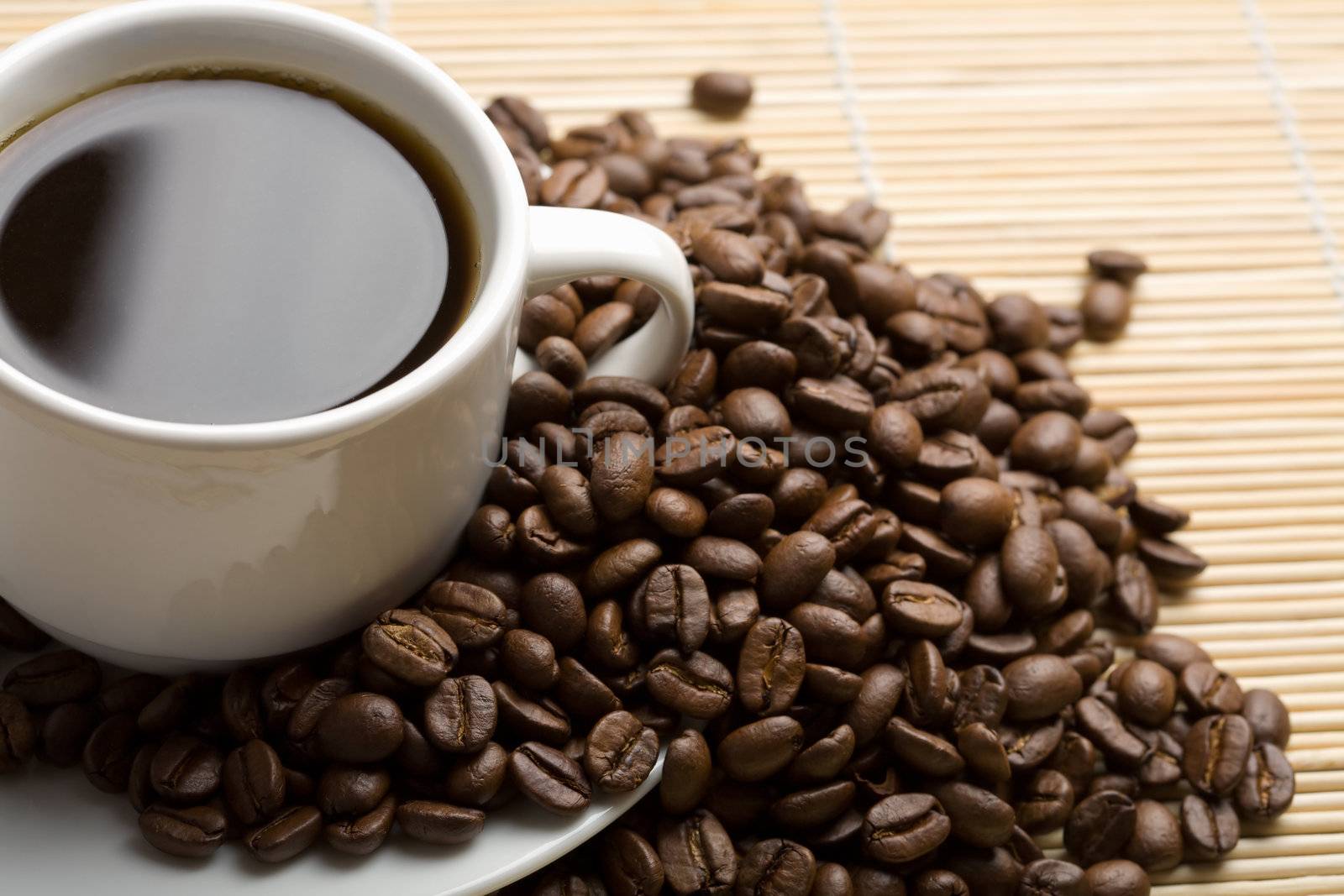 cup of coffee and coffee beans
